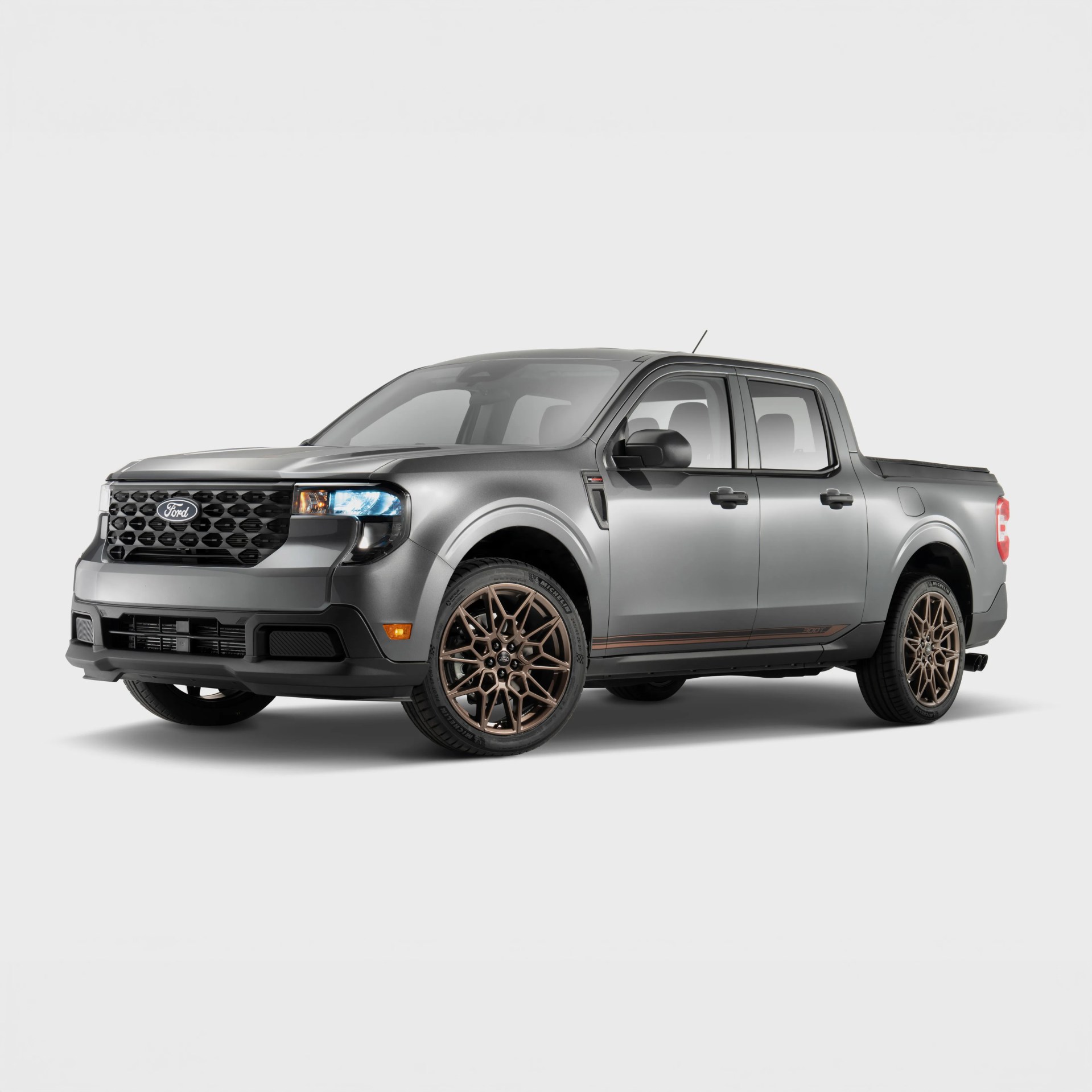 Gray Ford pickup truck with bronze multi-spoke wheels on a white background.