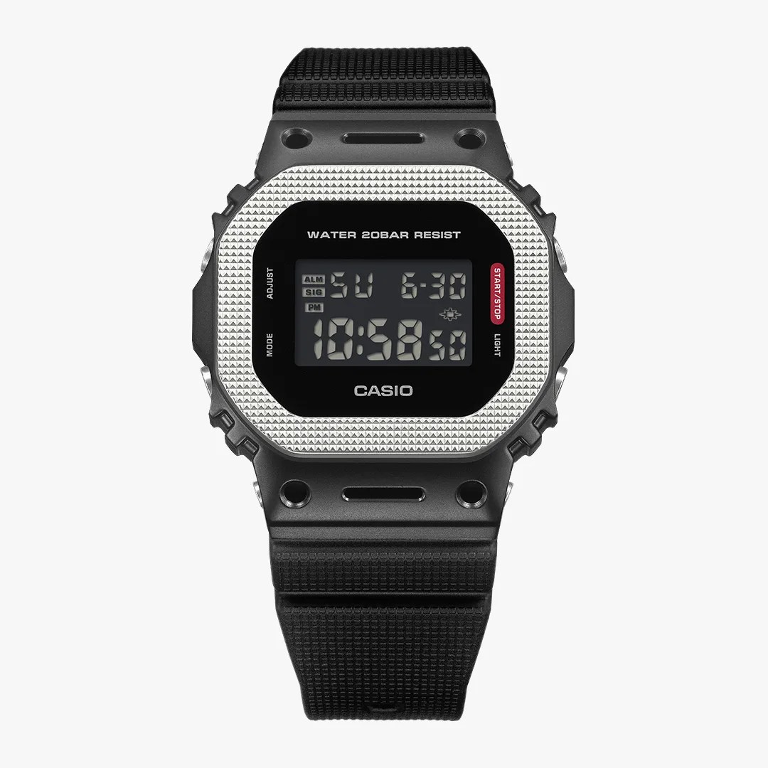 Black Casio digital watch with a textured silver bezel and black resin strap.