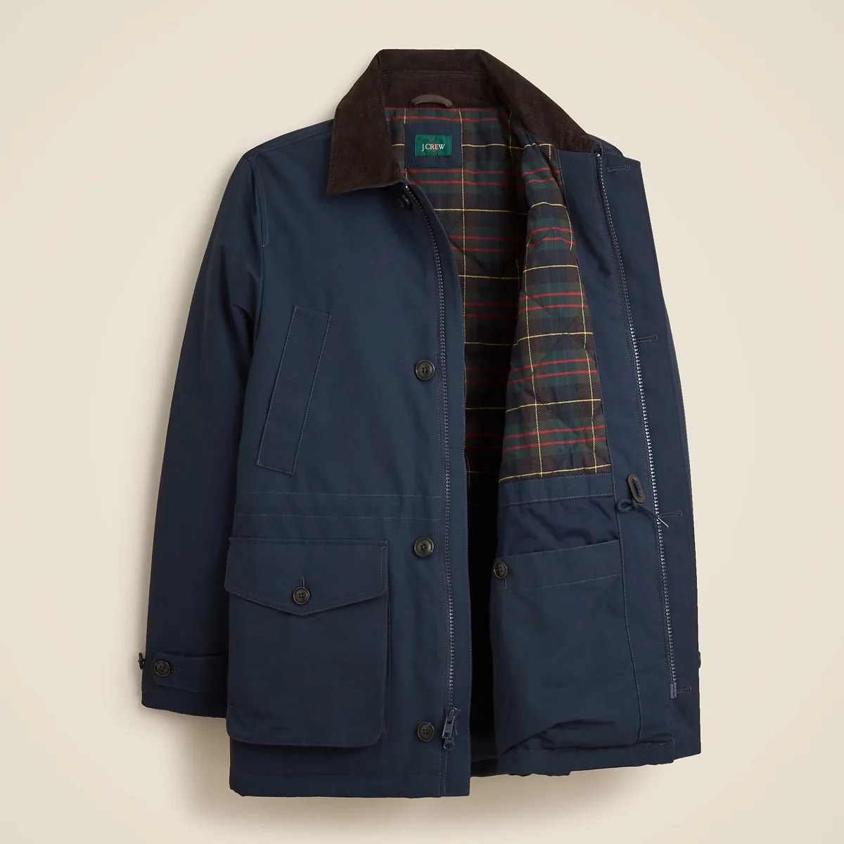 Navy blue jacket with brown corduroy collar and plaid interior lining, partially unzipped.