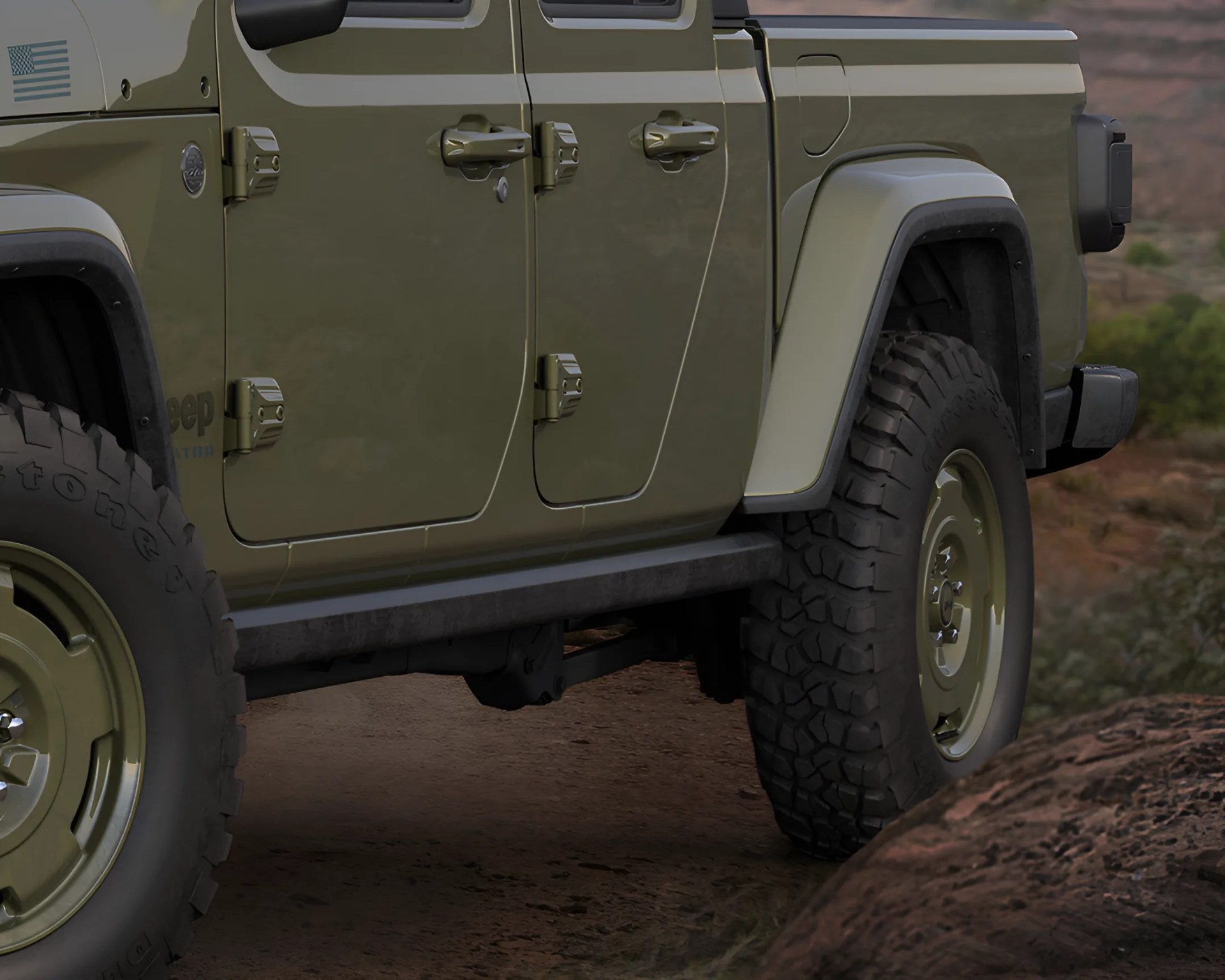 Close-up of olive green Jeep Gladiator doors and rugged off-road tires on a dirt trail.