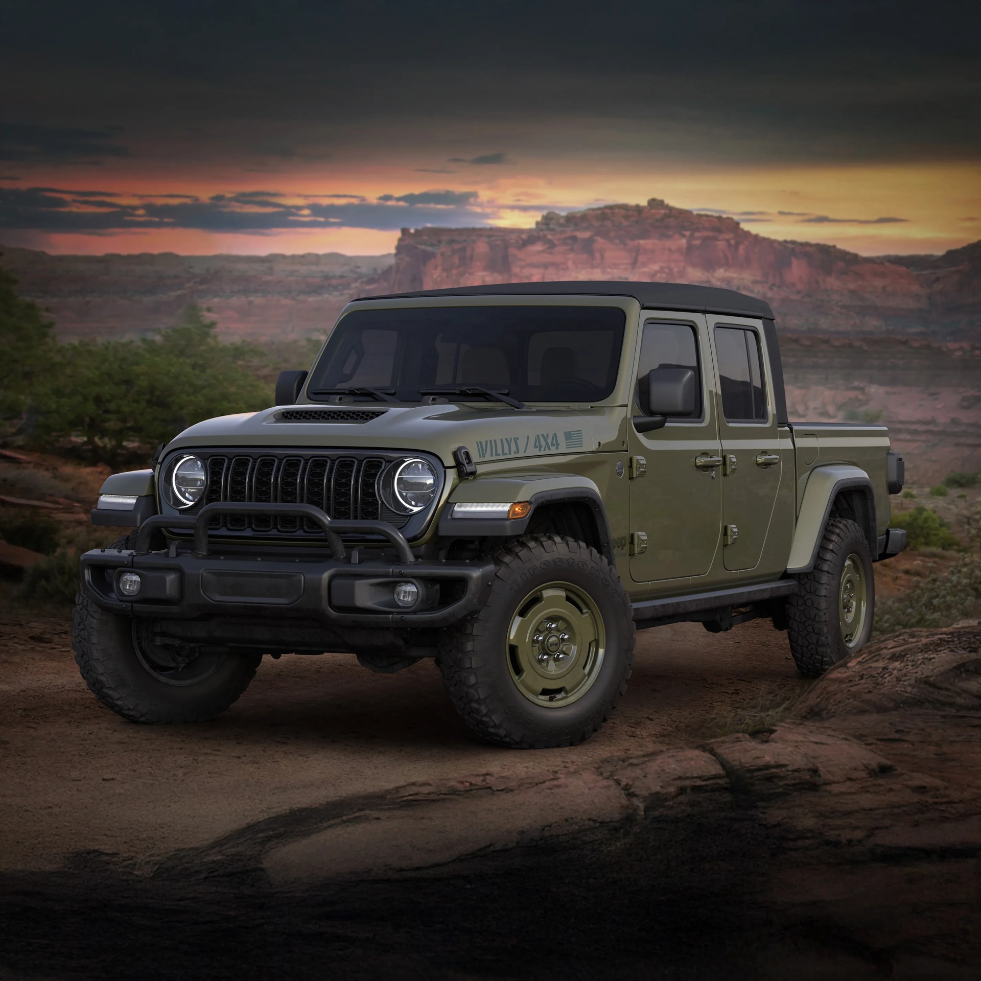 Olive green Jeep Gladiator Willys 4x4 pickup truck with black roof parked on dirt road at sunset.