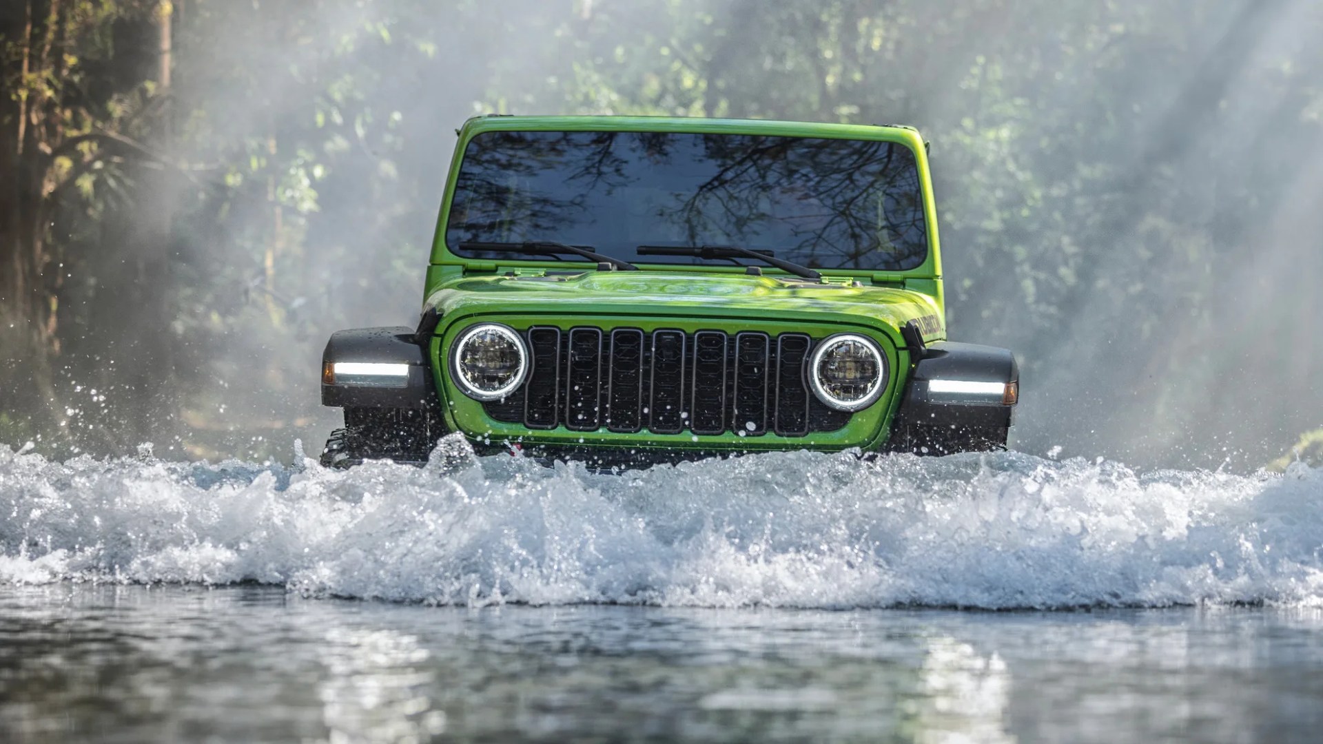 Bright green off-road vehicle driving through water with splashes in a forest setting.