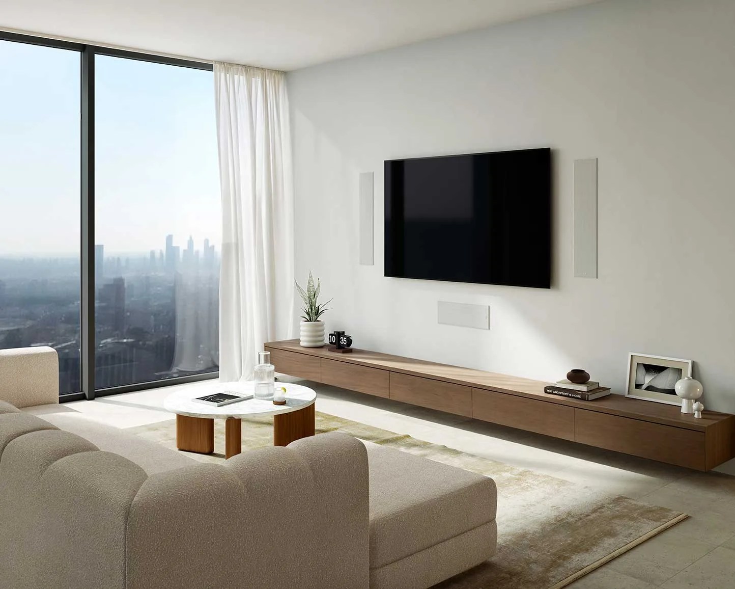 Minimalist living room with beige sectional sofa, marble coffee table, wall-mounted TV, and long wooden media console.