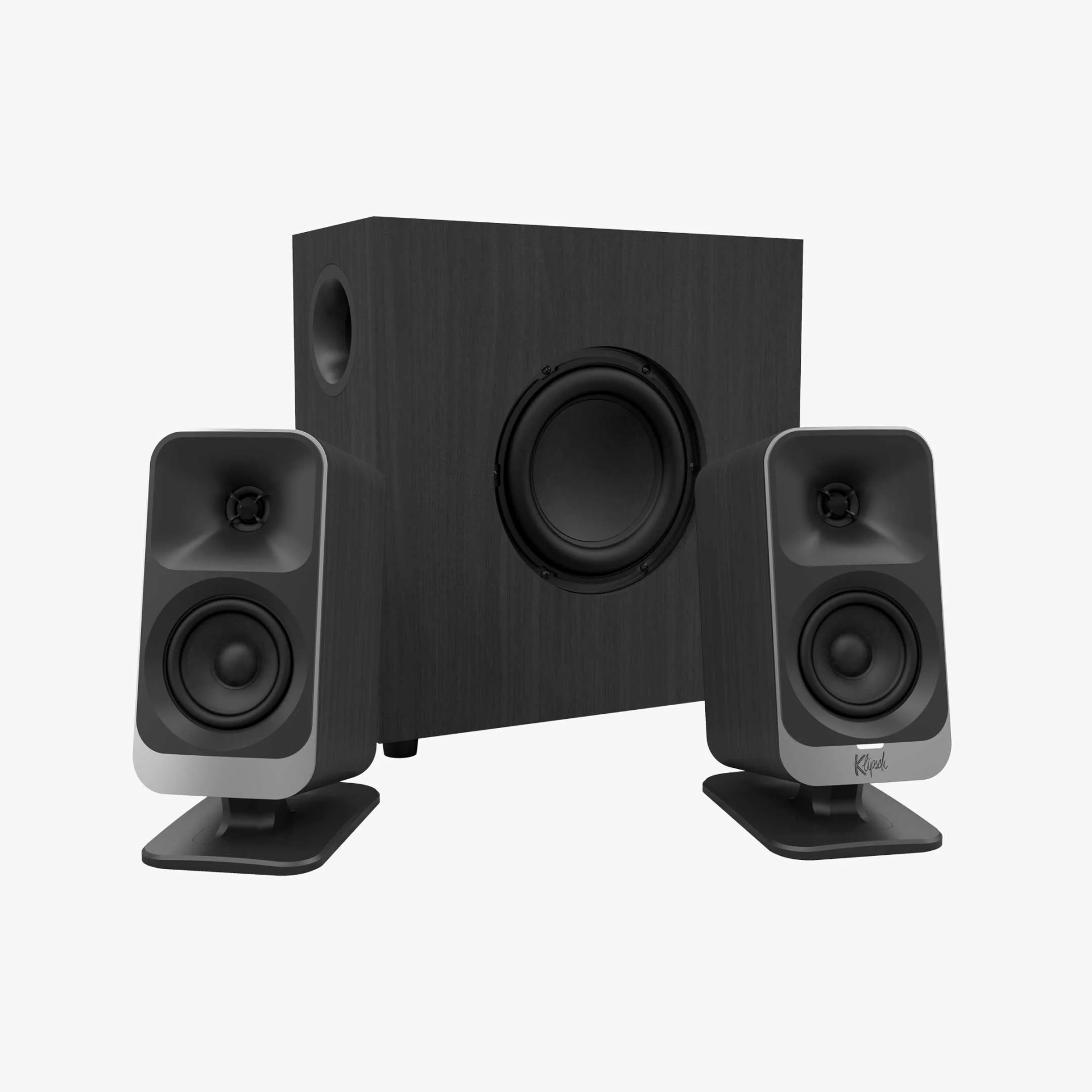 Black wooden subwoofer with two black and gray compact speakers on stands.