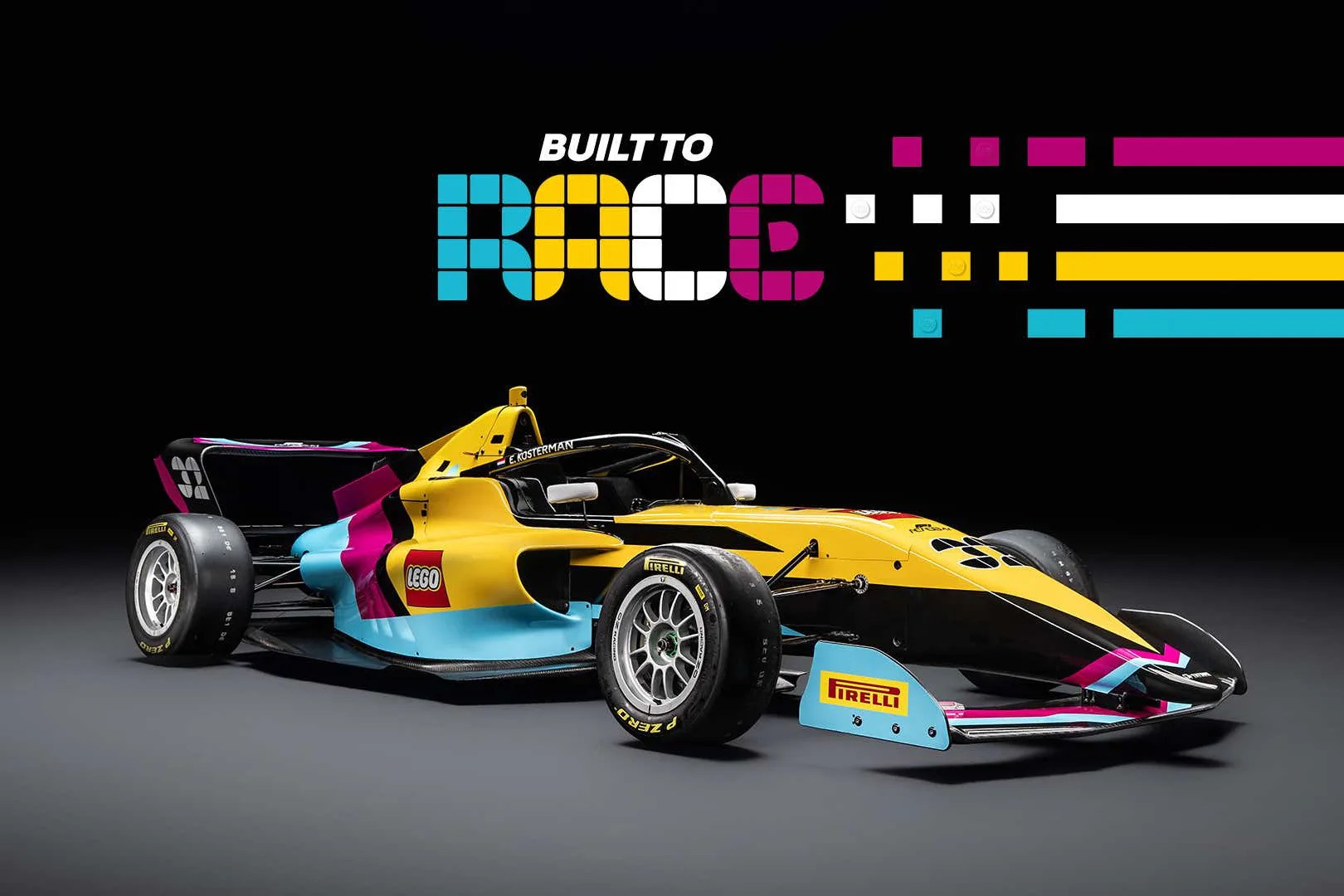 Yellow, black, blue, and pink LEGO-branded race car with Pirelli tires under "Built to Race" text on black background.