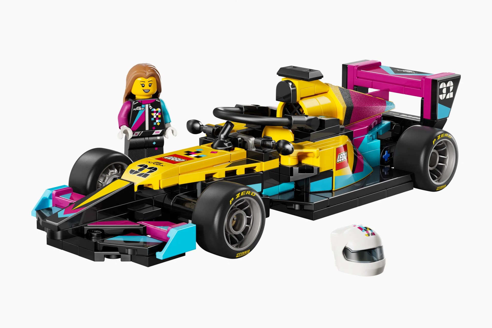 Yellow, pink, black, and blue LEGO Formula 1 race car with a female minifigure and white helmet.