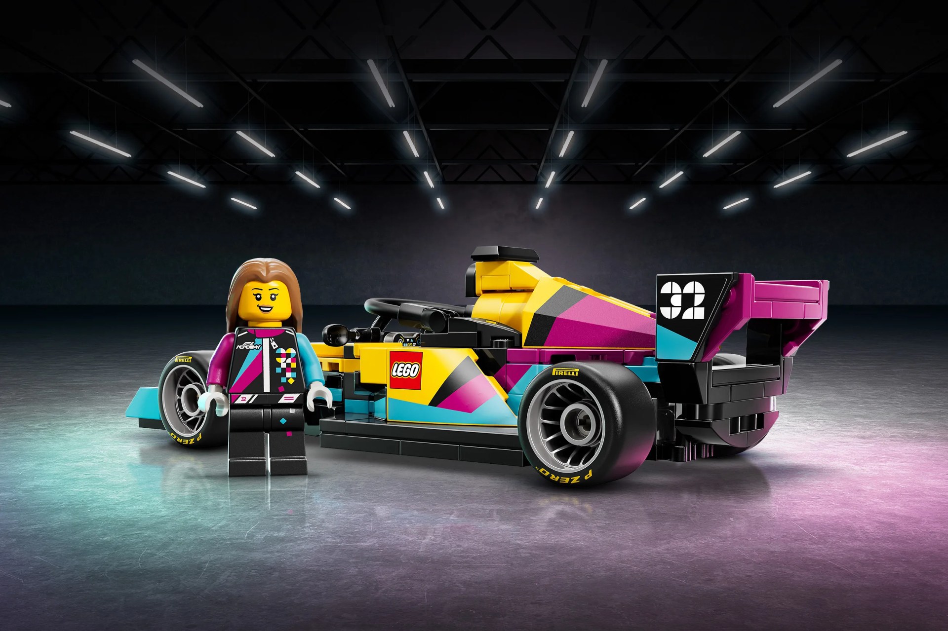 LEGO minifigure with brown hair standing next to a colorful LEGO race car with number 32 on the rear wing.