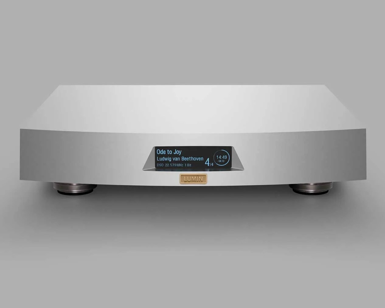 Silver Lumin audio streamer with digital display showing "Ode to Joy" by Beethoven.