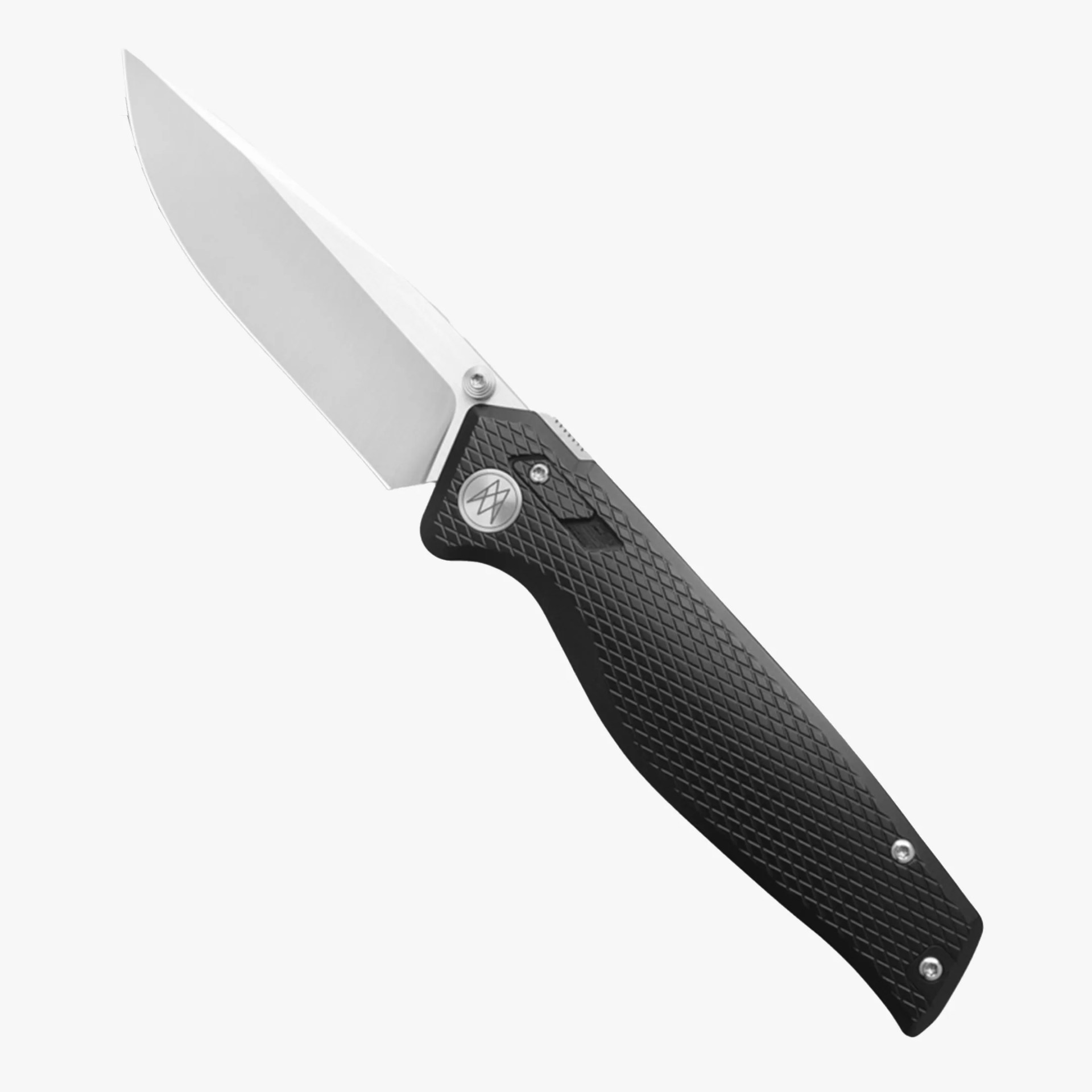 Folding knife with a silver blade and textured black handle featuring a circular metal emblem.