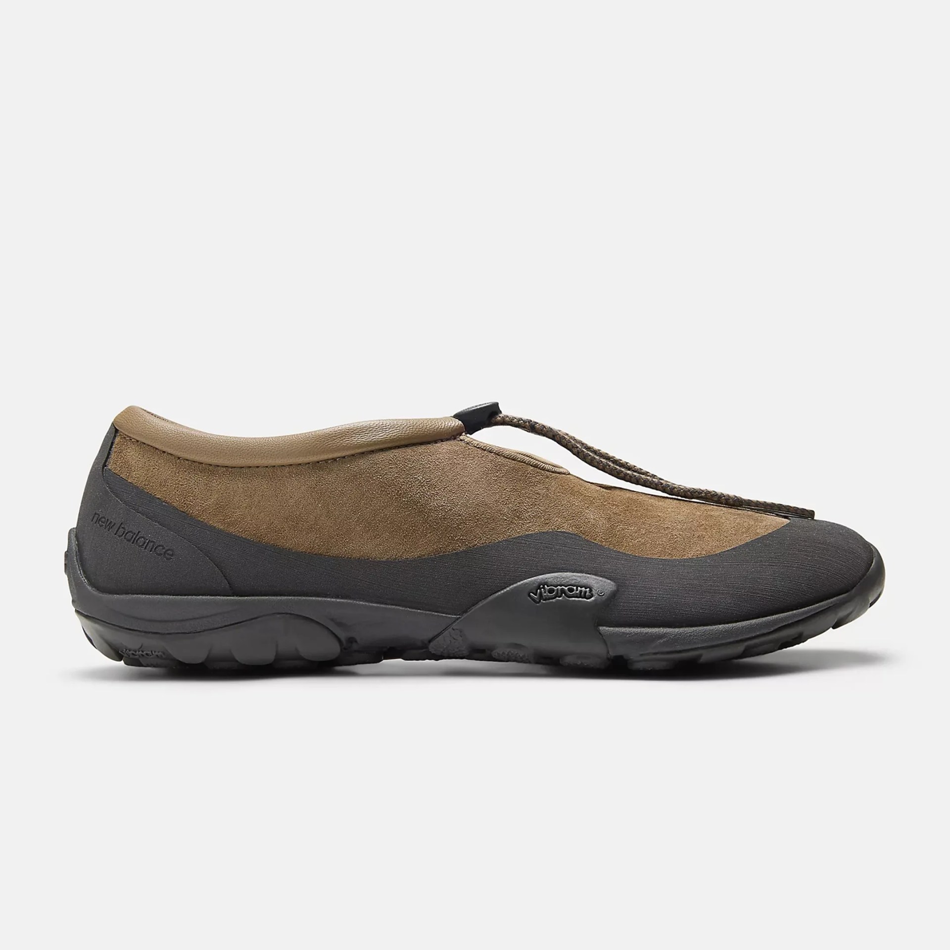 Brown suede and black rubber slip-on shoe with Vibram sole and elastic cord closure.