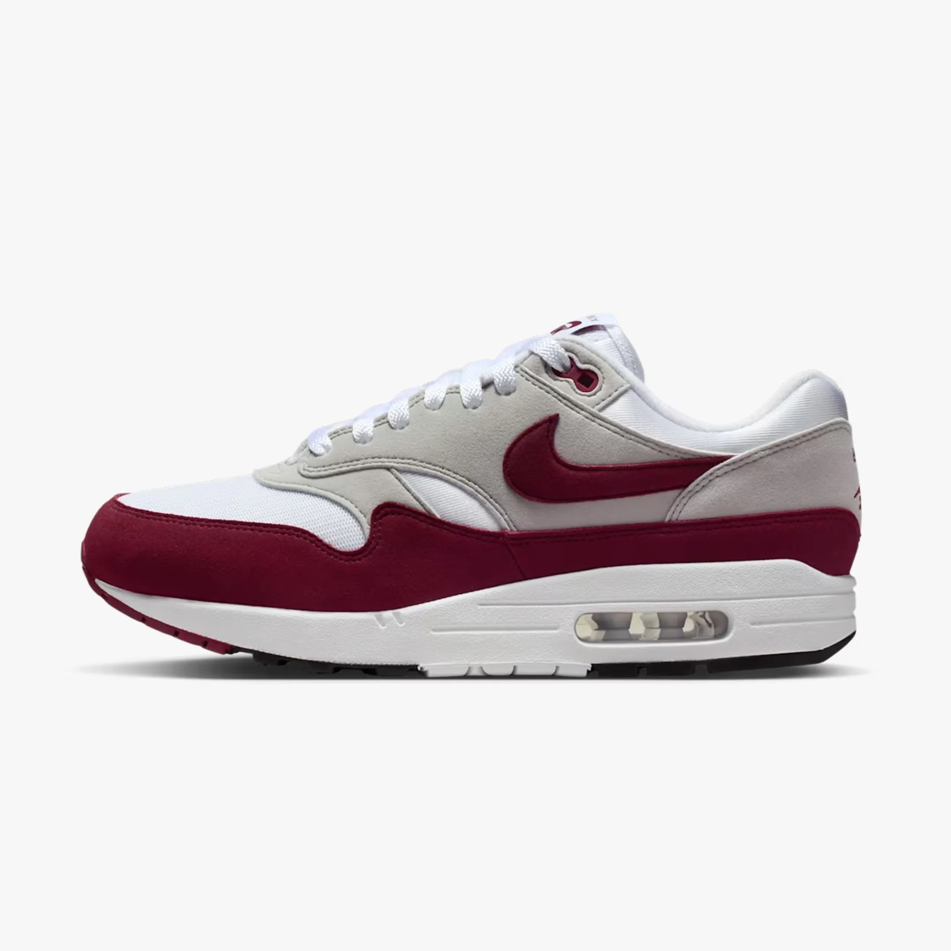 White and maroon Nike Air Max 1 sneaker with visible air cushioning in the sole.