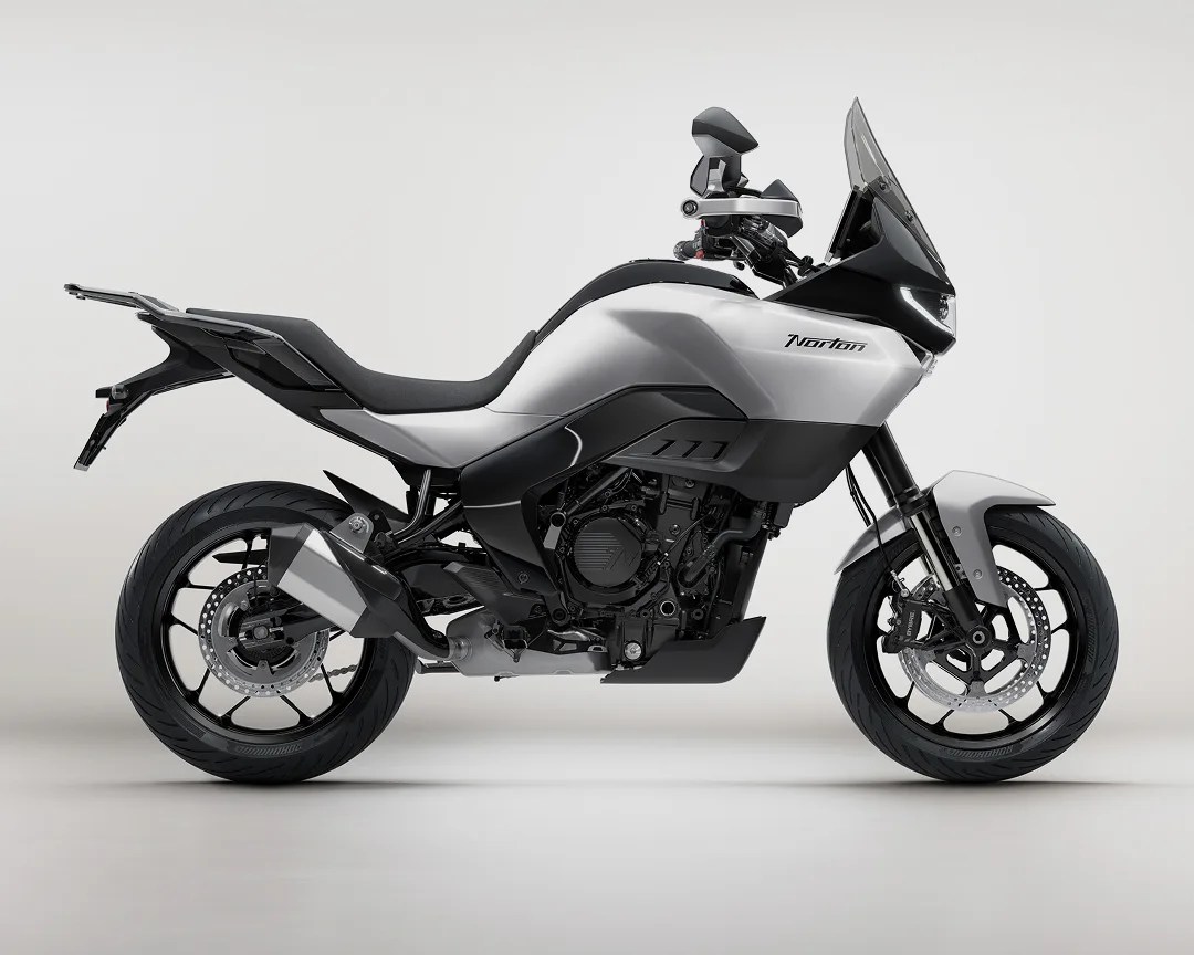Silver and black Norton adventure motorcycle with windshield and dual disc brakes on a white background.