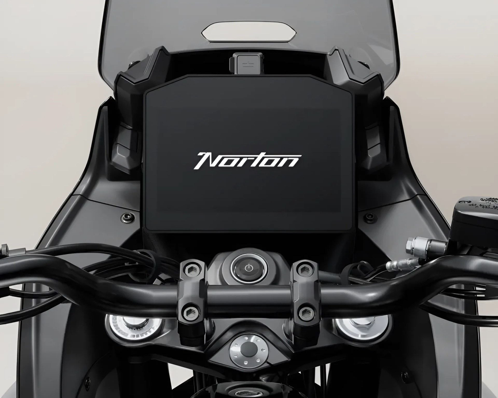 Black motorcycle handlebar with digital display screen showing "Norton" logo.