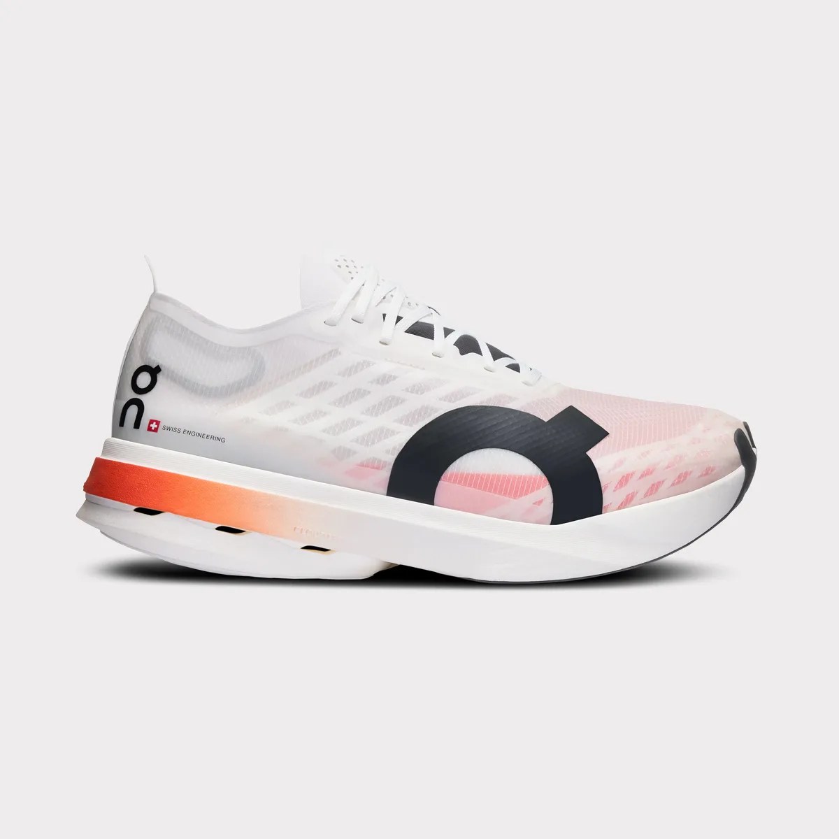 White and pink translucent running shoe with black logo and orange gradient midsole stripe.