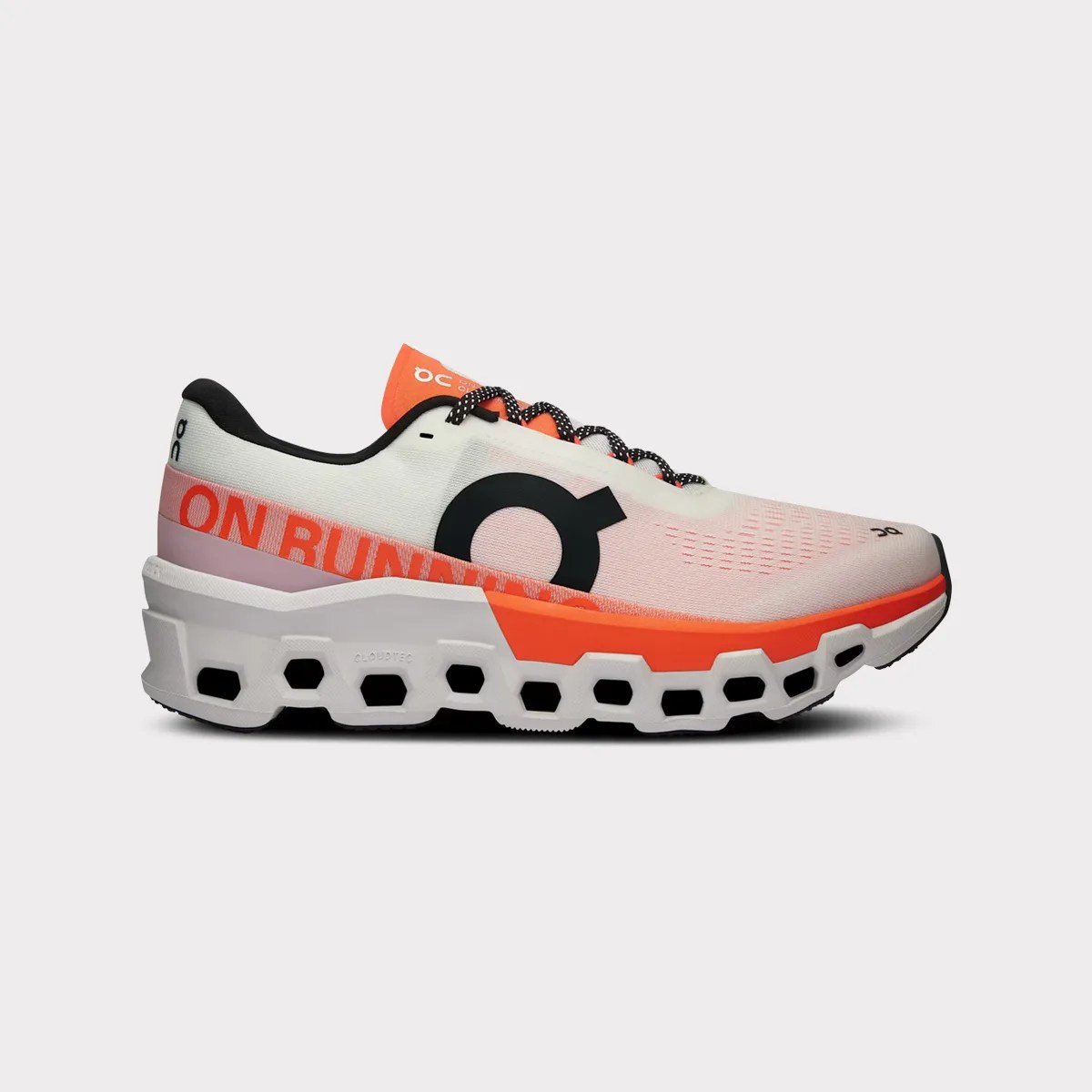 White and orange On running shoe with black logo and hexagonal cutouts in the sole.