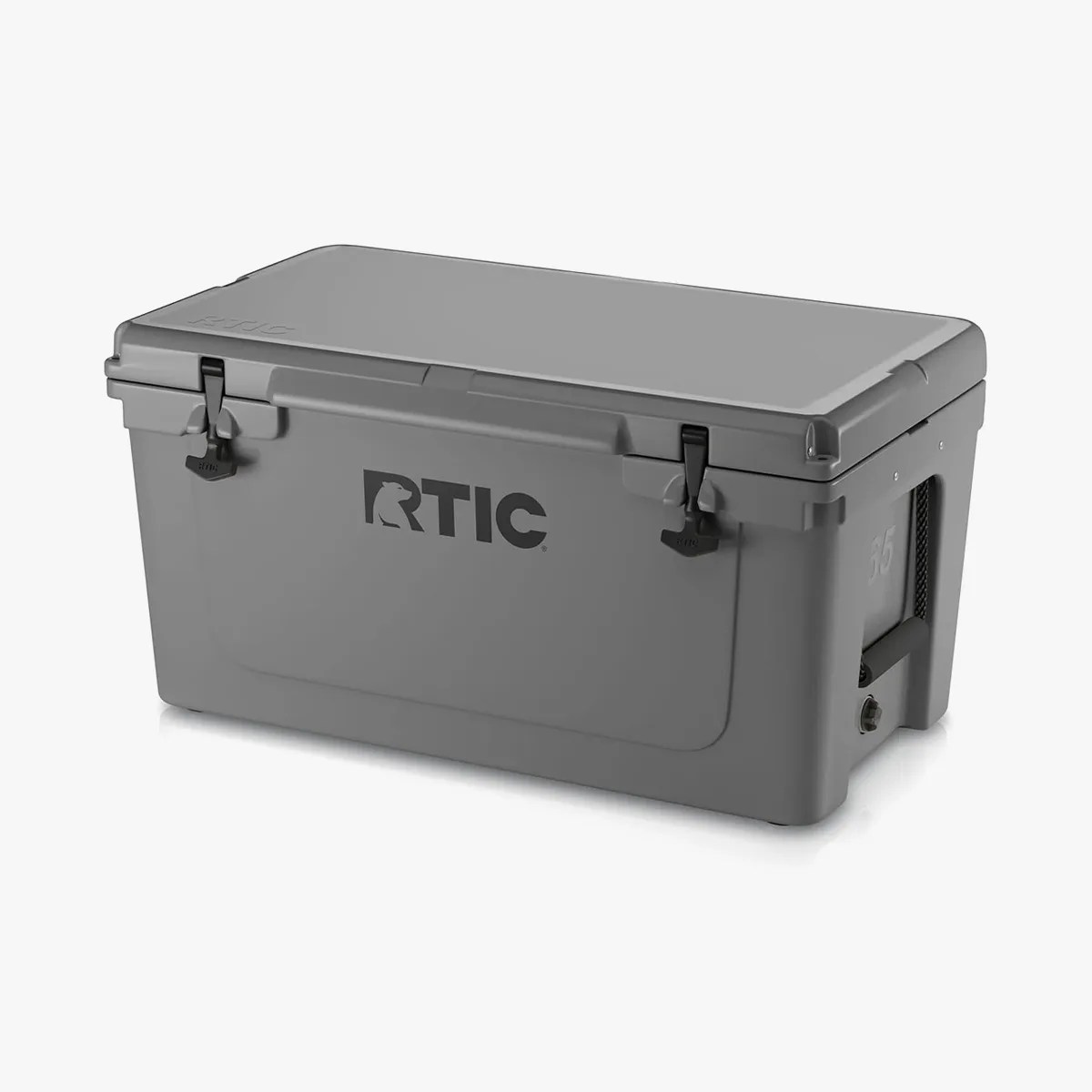 Gray RTIC cooler box with black latches and side handle.