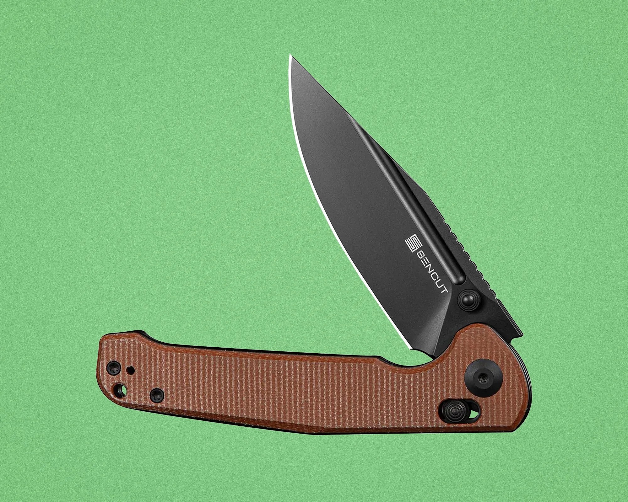 Folding knife with black blade and brown textured handle on a green background.