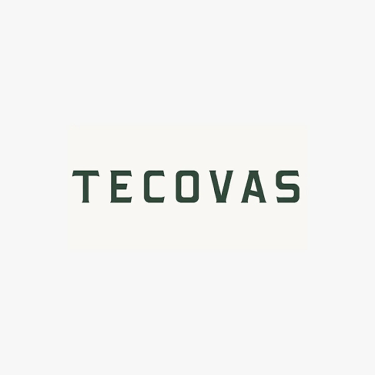 Dark green "TECOVAS" text logo on a light beige background.