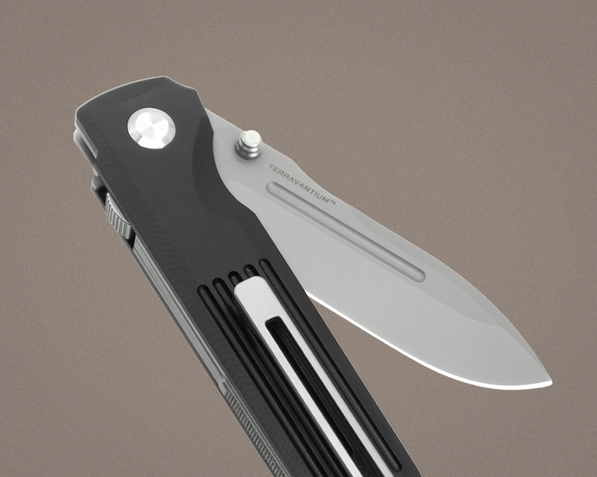 Folding knife with a partially open silver blade labeled "TERRAVANTIUM&trade;" and a black textured handle with a metal clip.
