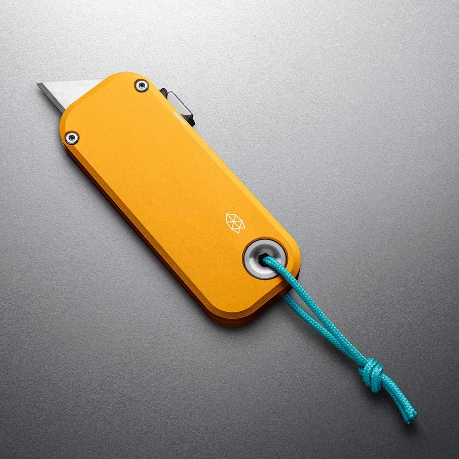 Compact yellow utility knife with a partially extended blade and a blue lanyard attached.