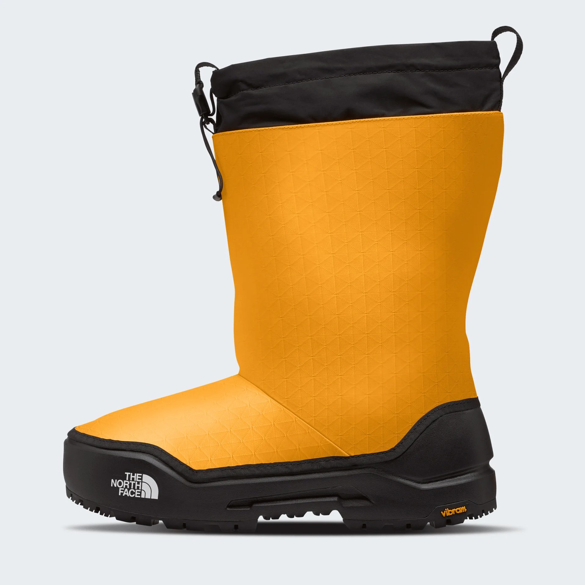 Yellow and black insulated winter boot with black sole and The North Face logo on the toe.