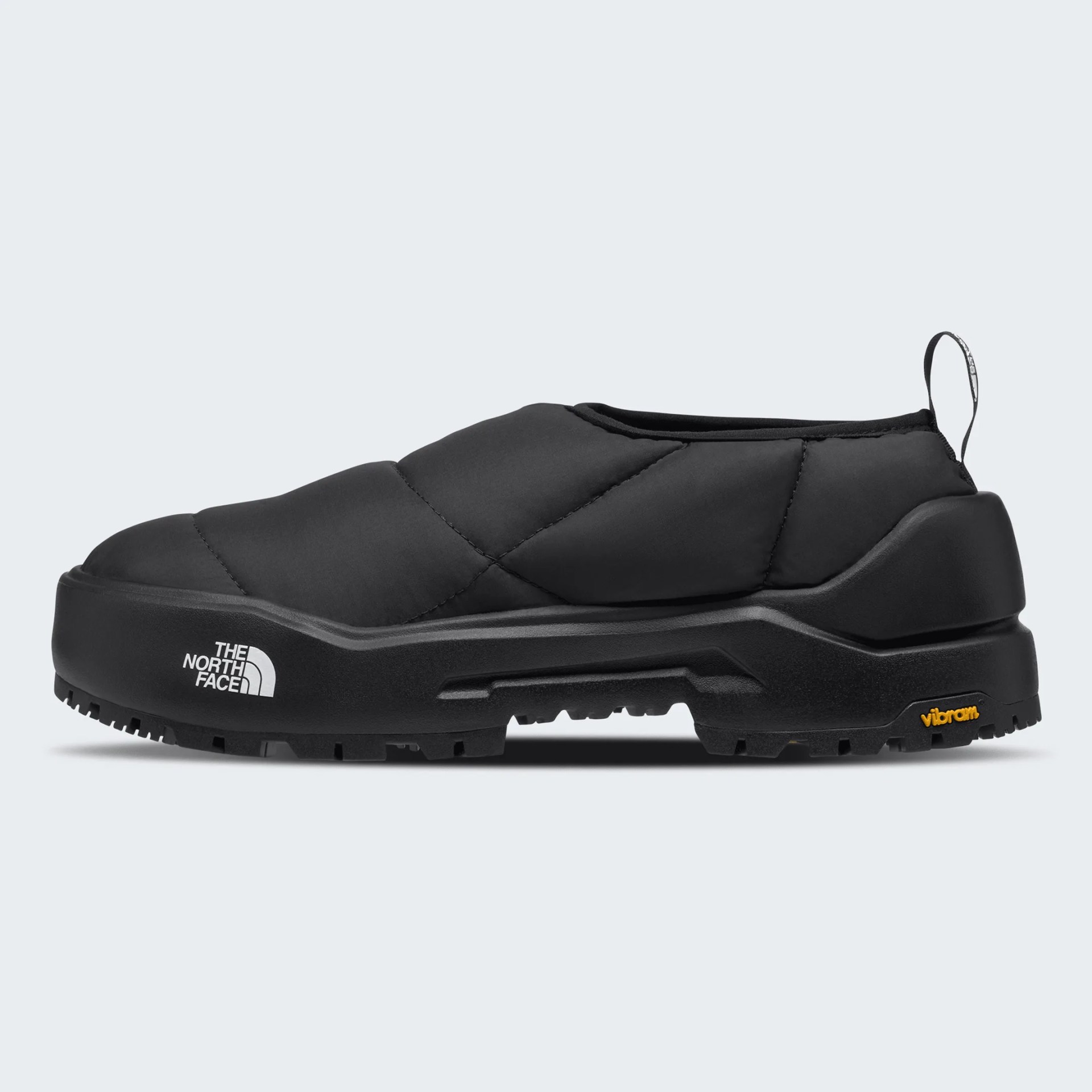 Black slip-on insulated shoe with thick sole and The North Face logo on the side.