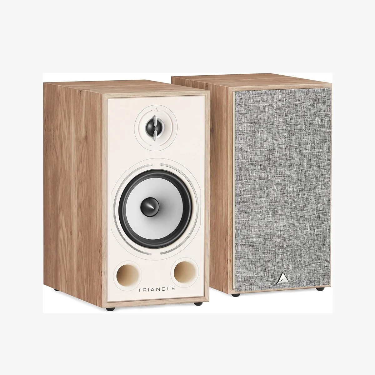 Pair of bookshelf speakers with light wood finish, one with white front panel and exposed drivers, the other with gray fabric grille.