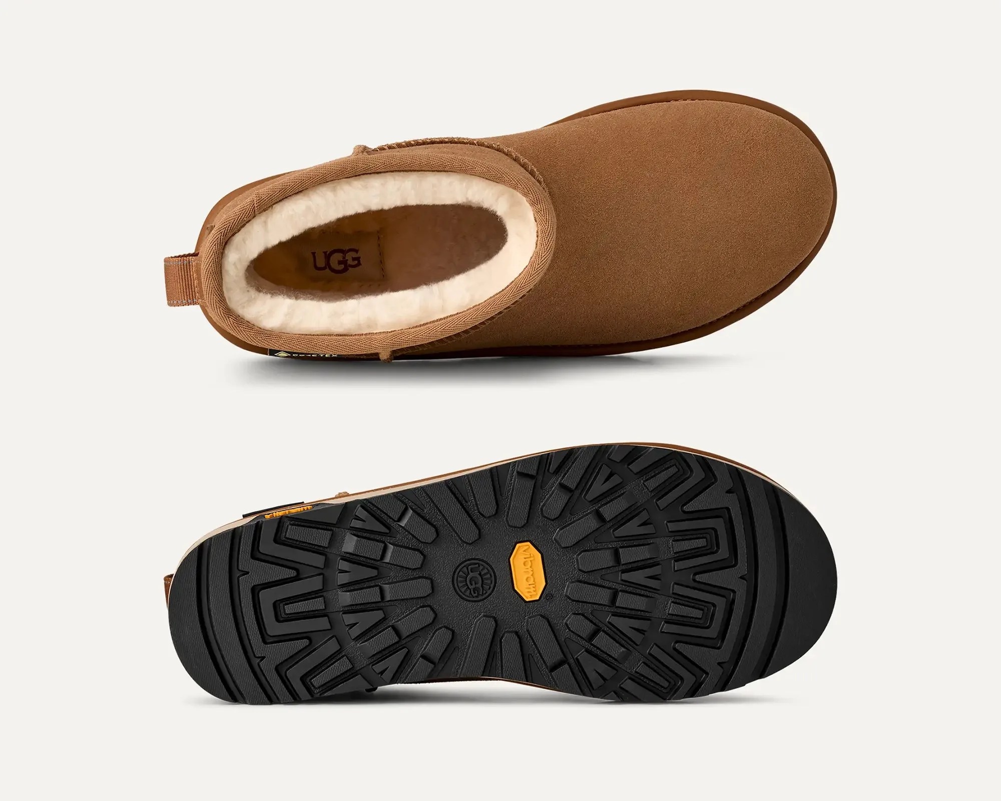 Chestnut brown suede UGG boot with white fleece lining and black Vibram sole shown from top and bottom.