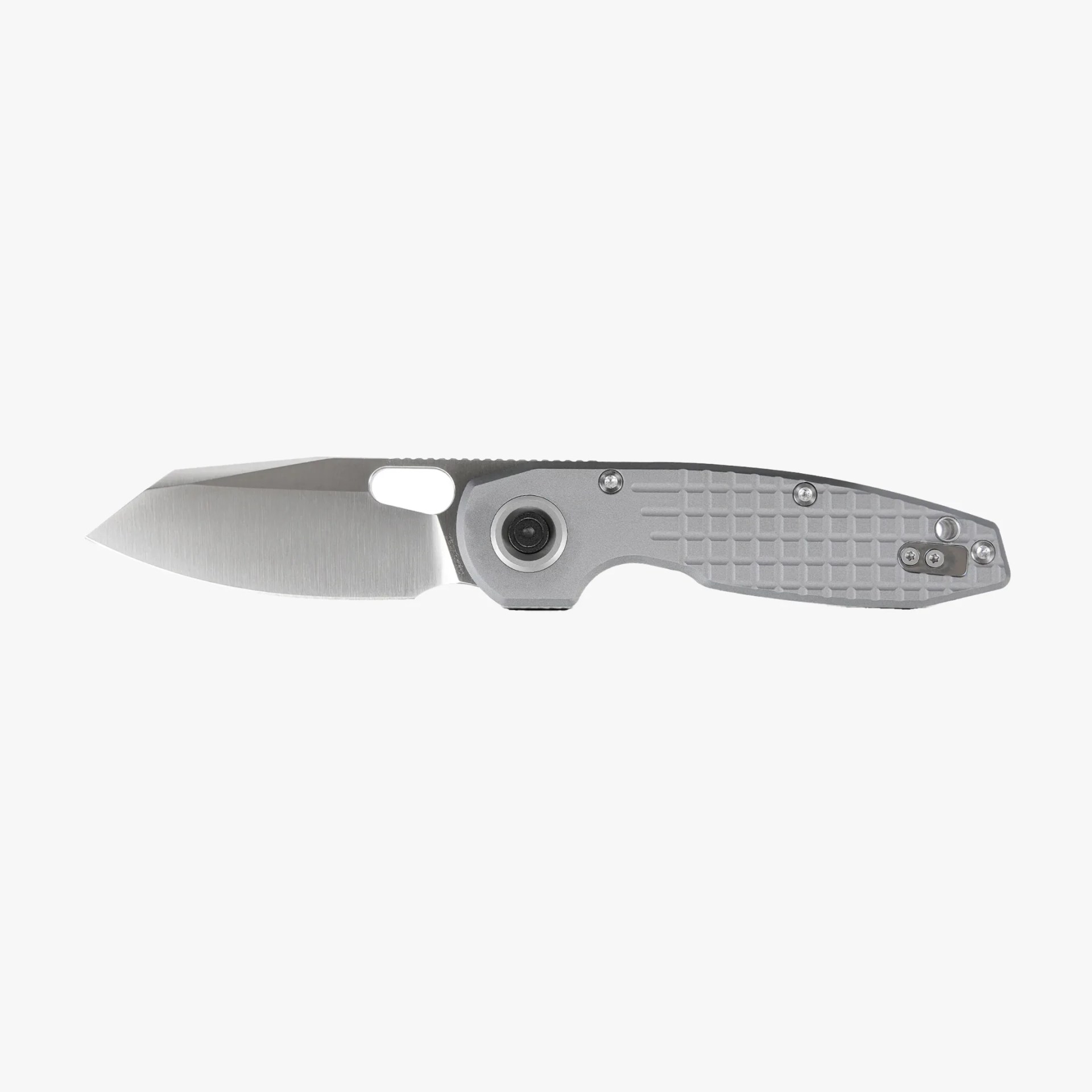 Silver folding knife with a textured handle and a wide, straight-edged blade.