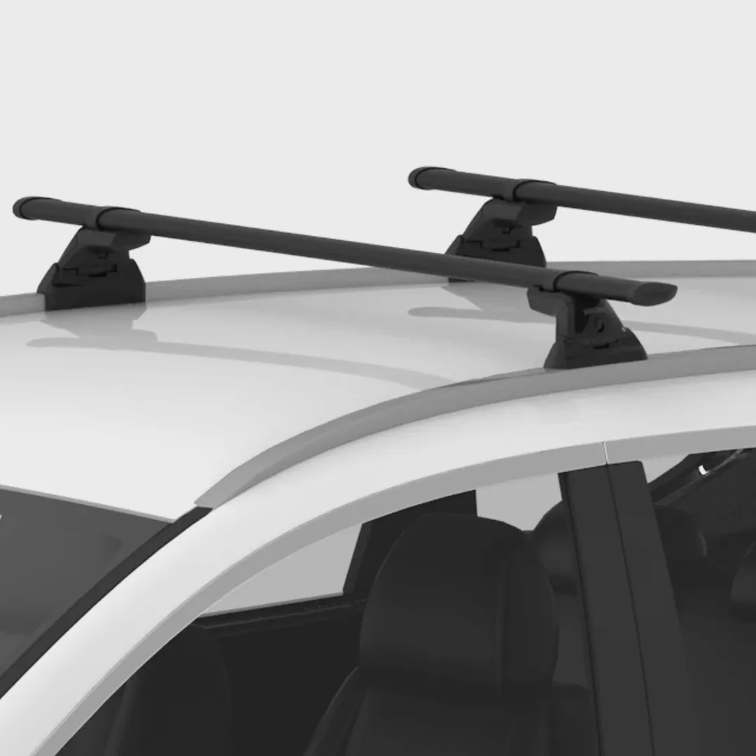 Black roof rack crossbars mounted on the white roof of a car.