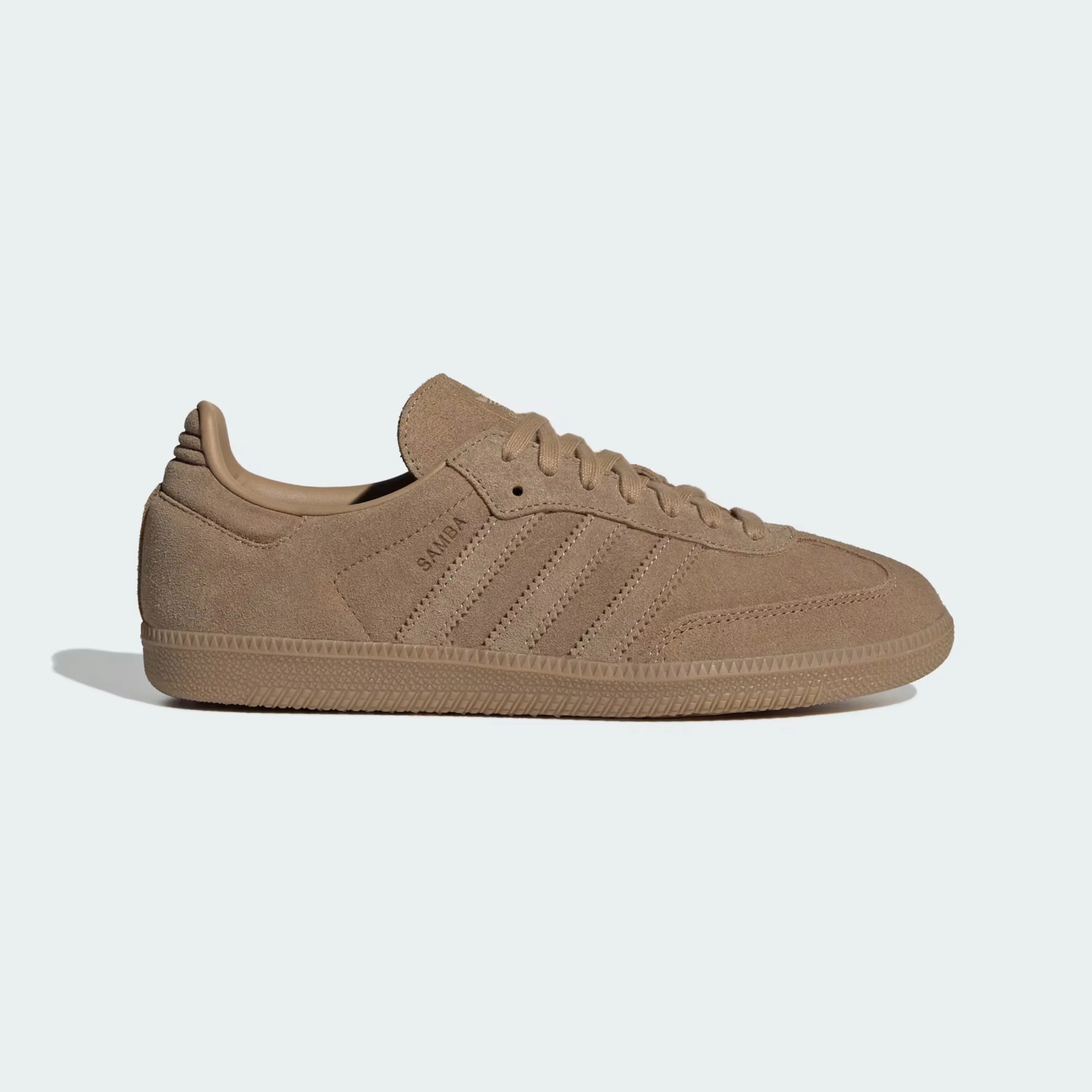 Tan suede Adidas Samba sneaker with tonal laces and rubber sole, side view.