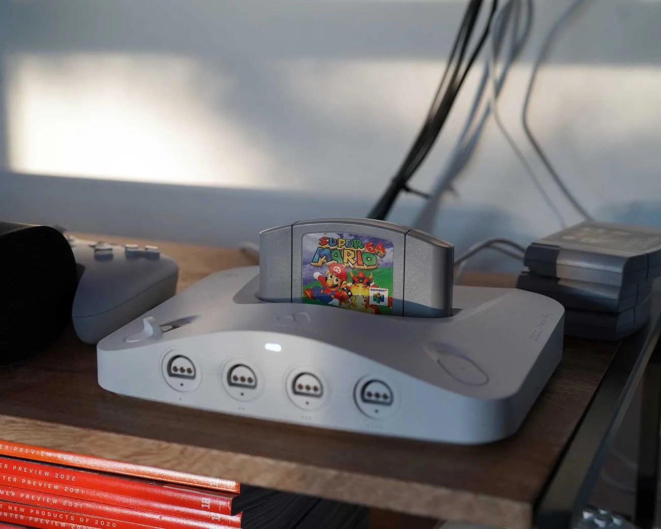 Nintendo 64 console with Super Mario 64 game cartridge inserted on a wooden shelf.