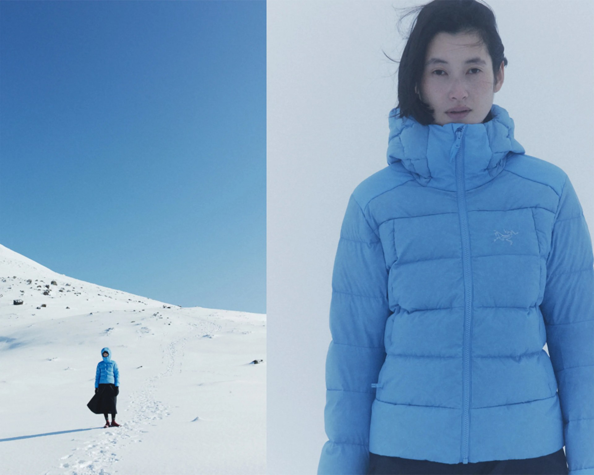 Light blue puffer jacket with high collar worn by a person in a snowy landscape.