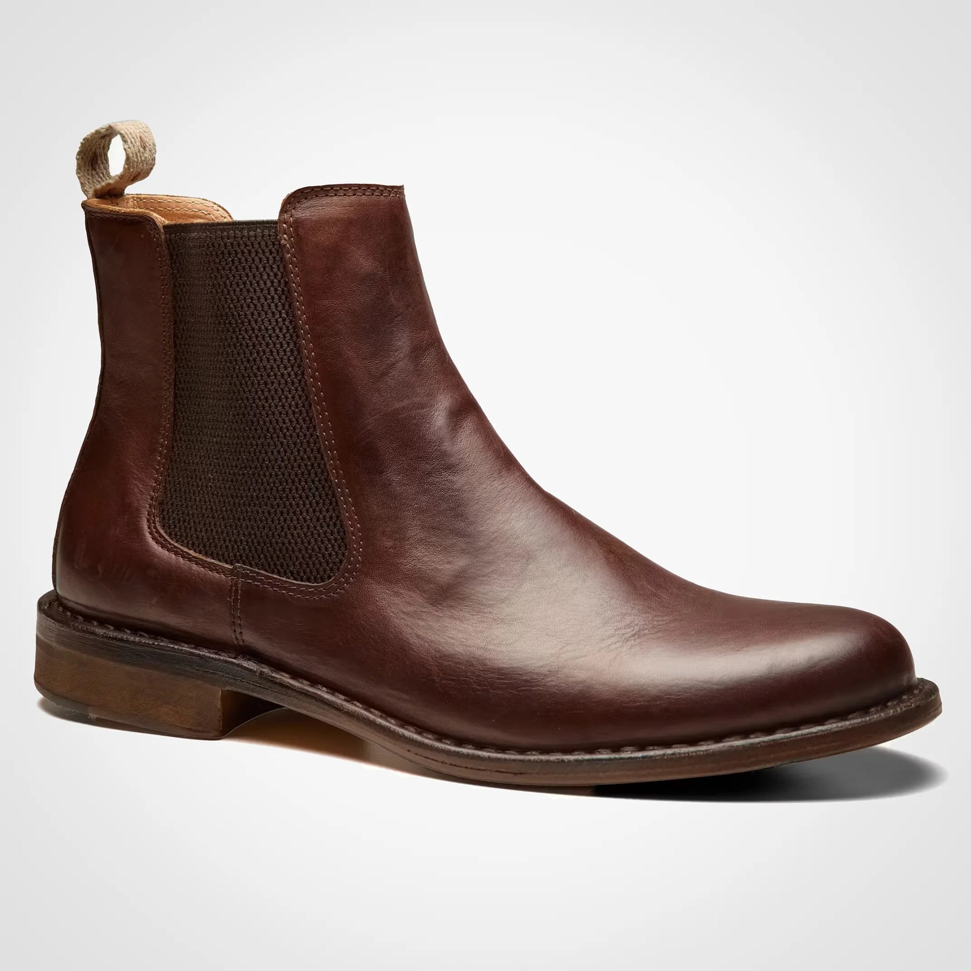 Brown leather Chelsea boot with dark elastic side panel and tan pull tab at the back.