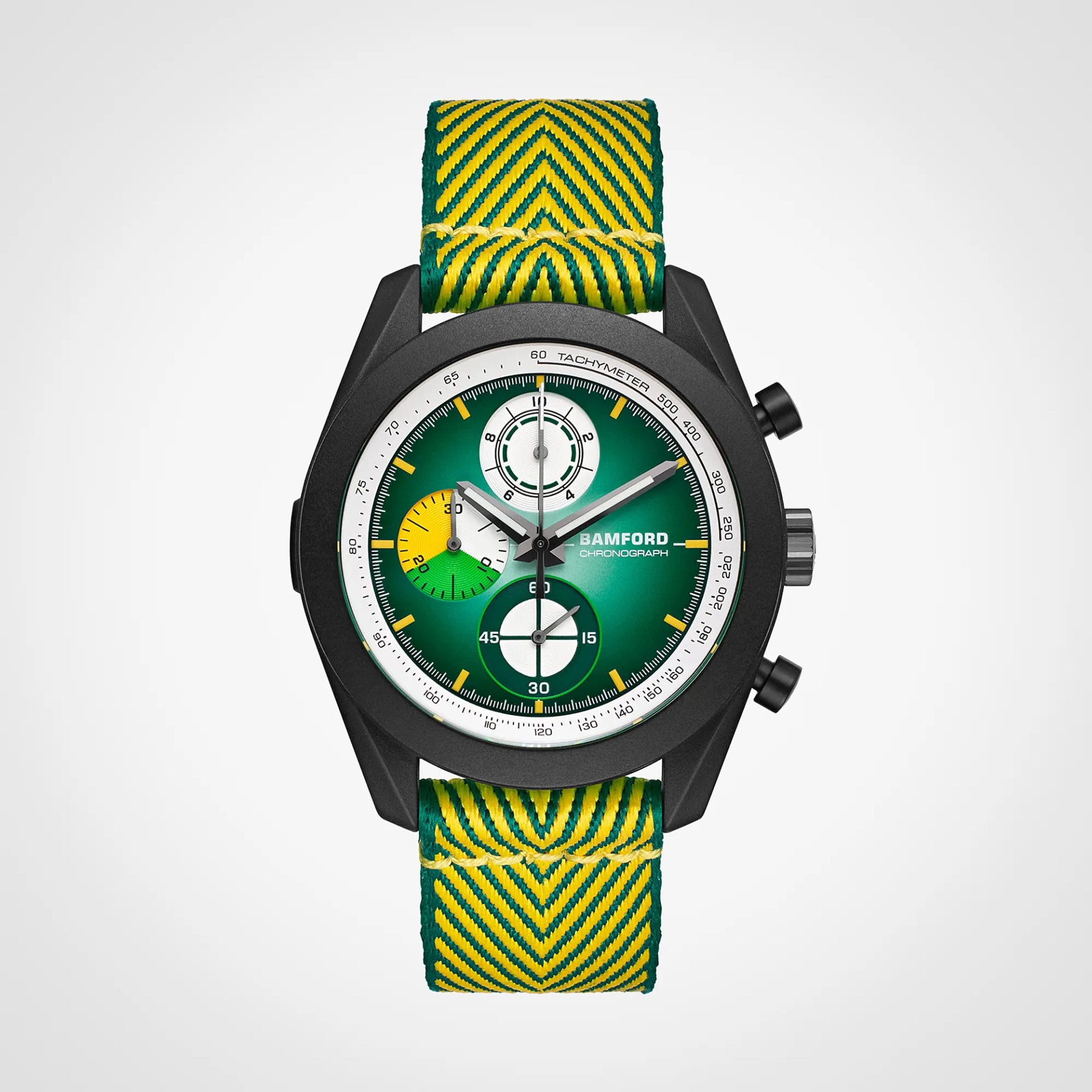 Black Bamford chronograph watch with green dial, yellow and white subdials, and green-yellow patterned fabric strap.