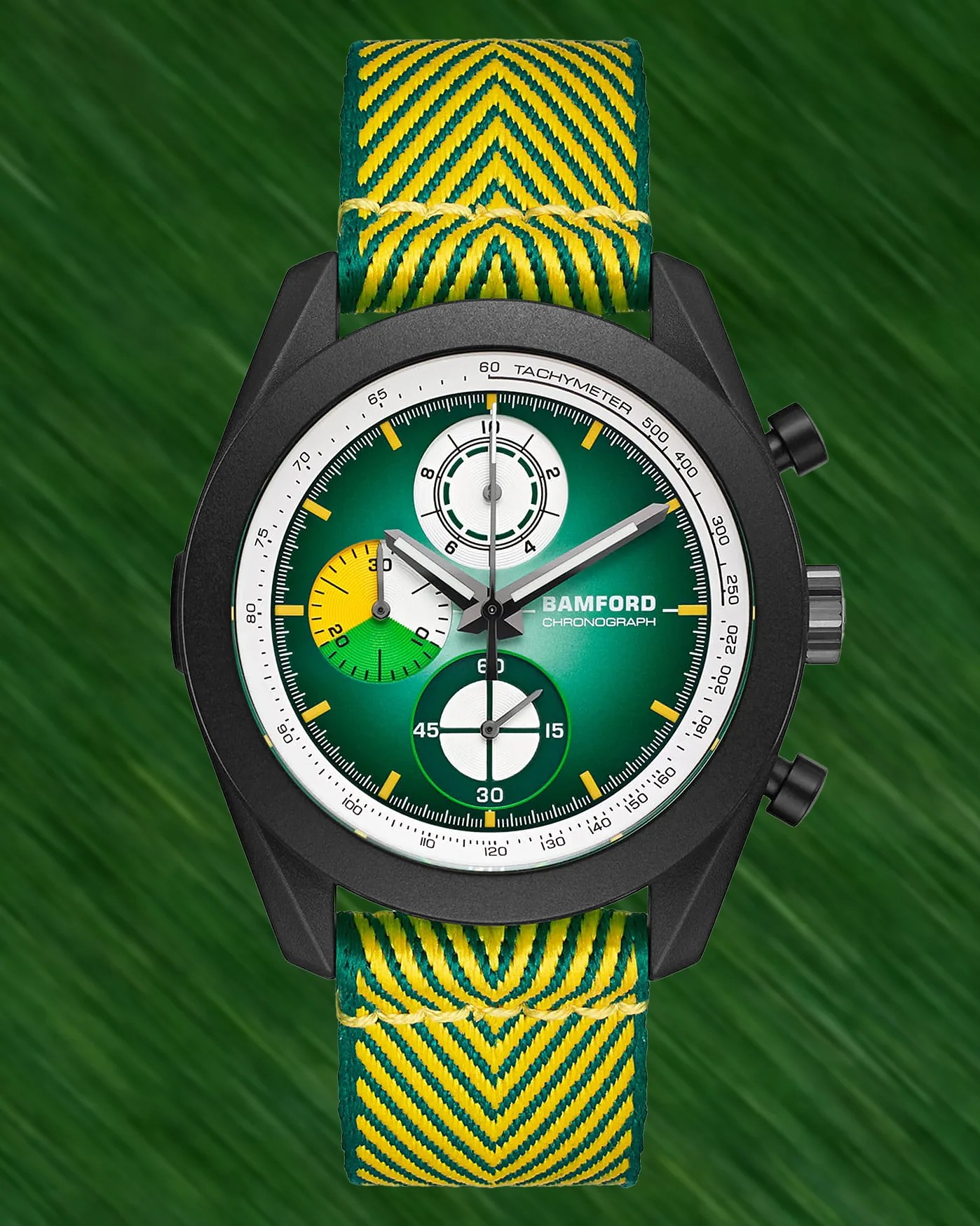 Black Bamford chronograph watch with green dial, yellow and white subdials, and green-yellow patterned fabric strap.