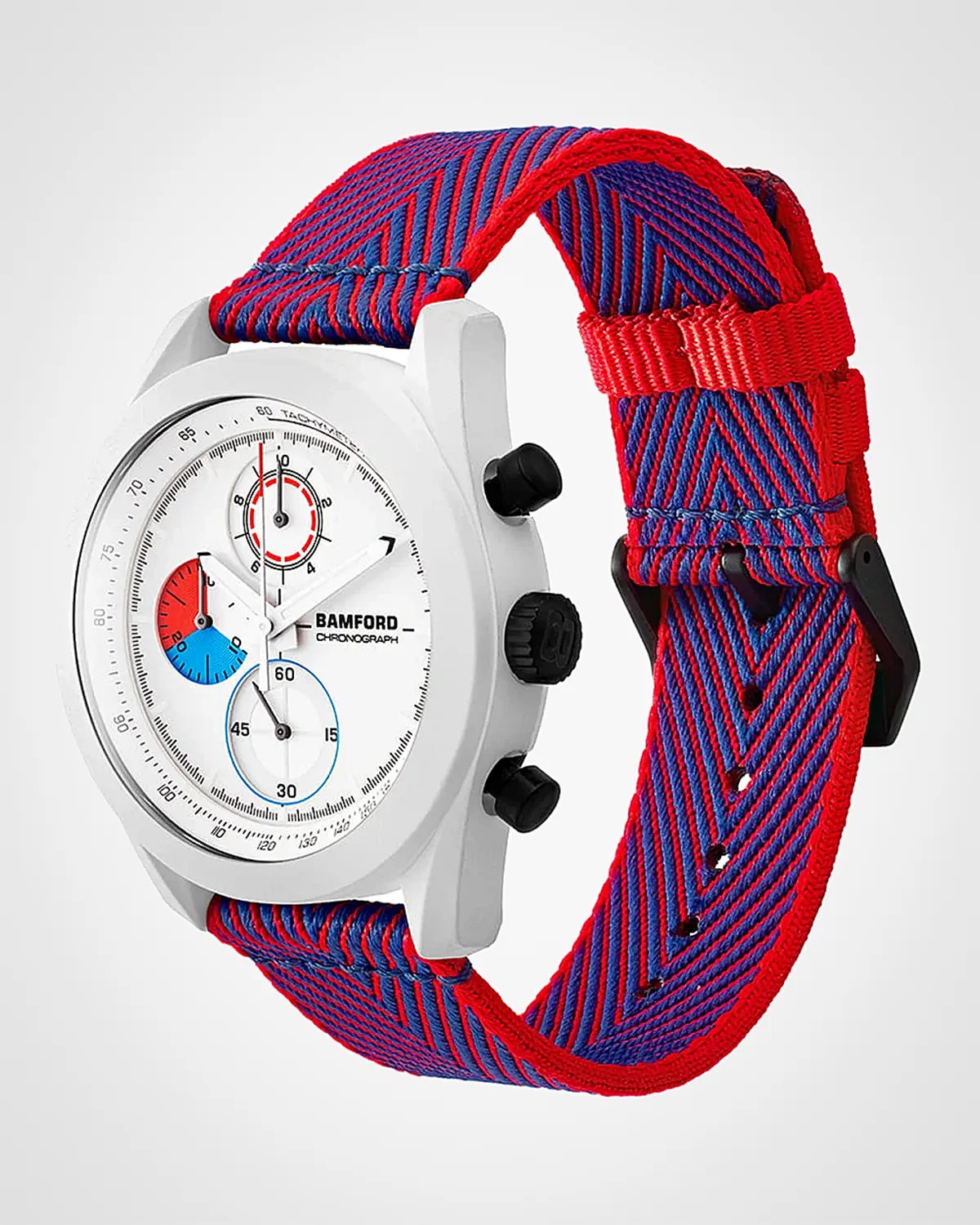 White Bamford chronograph watch with black buttons and red-and-blue striped fabric strap.