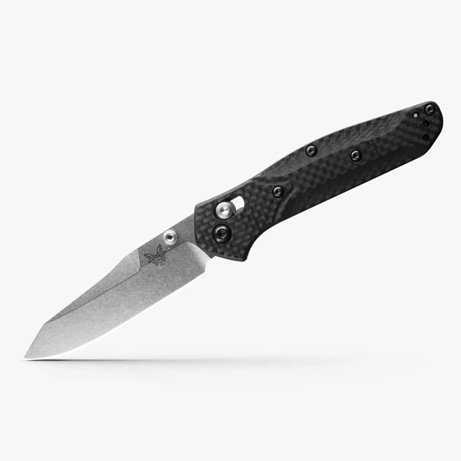Folding knife with a stonewashed tanto blade and black textured carbon fiber handle.