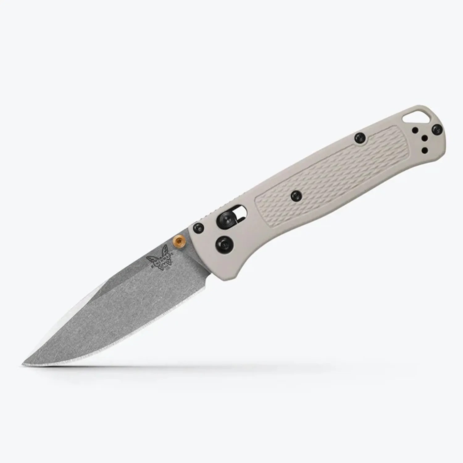 Folding knife with stonewashed blade and textured light gray handle with black screws.