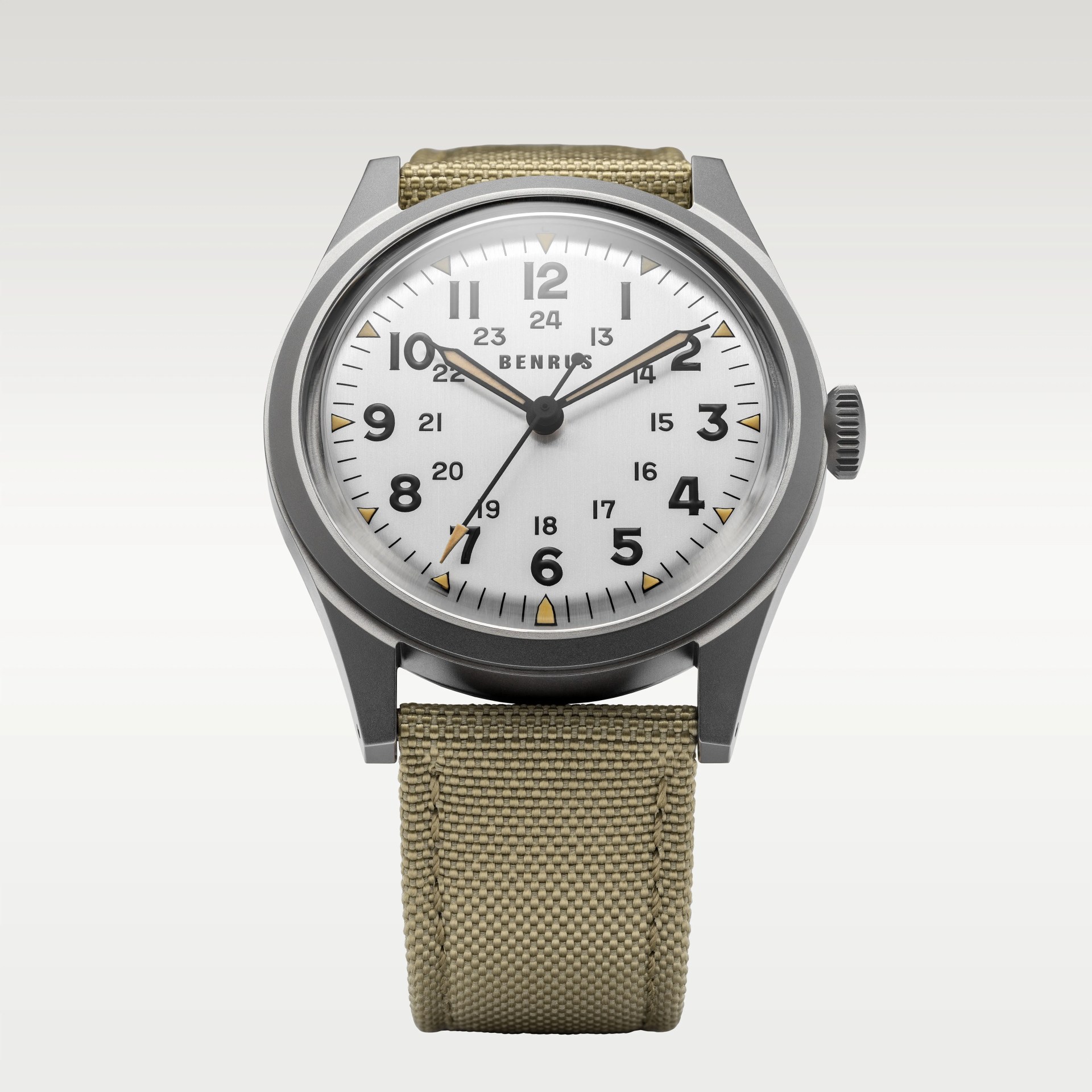 Round silver Benrus wristwatch with black numerals, beige fabric strap, and luminous hands and markers.
