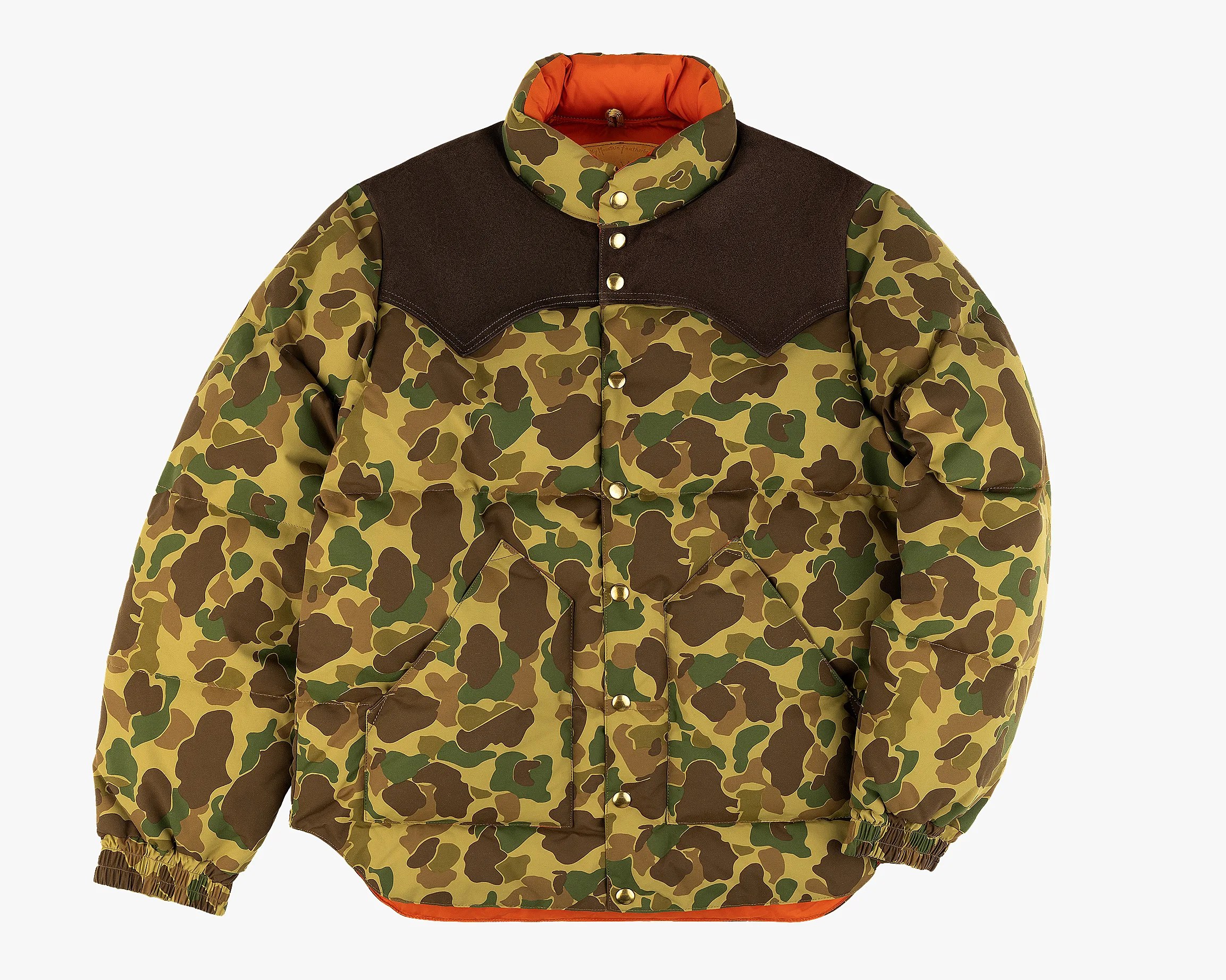 Camouflage puffer jacket with brown shoulder yoke, snap buttons, and orange lining.