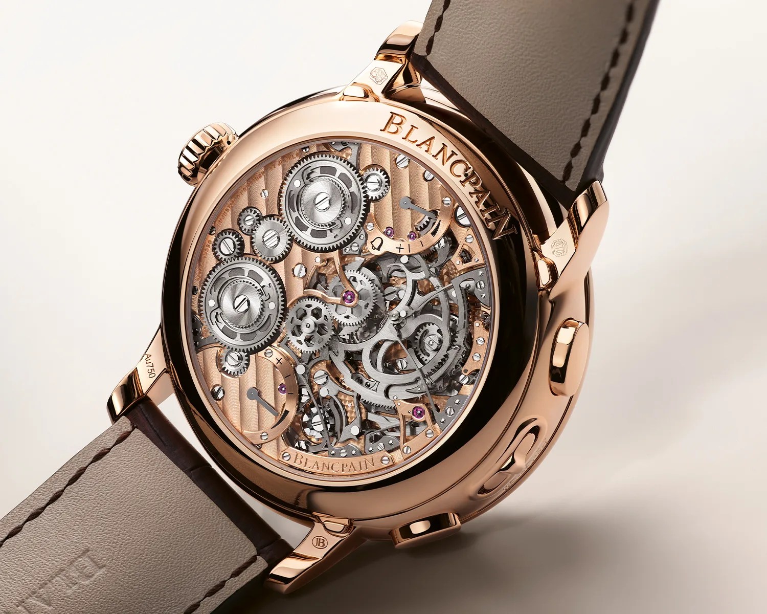 Rose gold Blancpain wristwatch with visible intricate mechanical gears and a brown leather strap.
