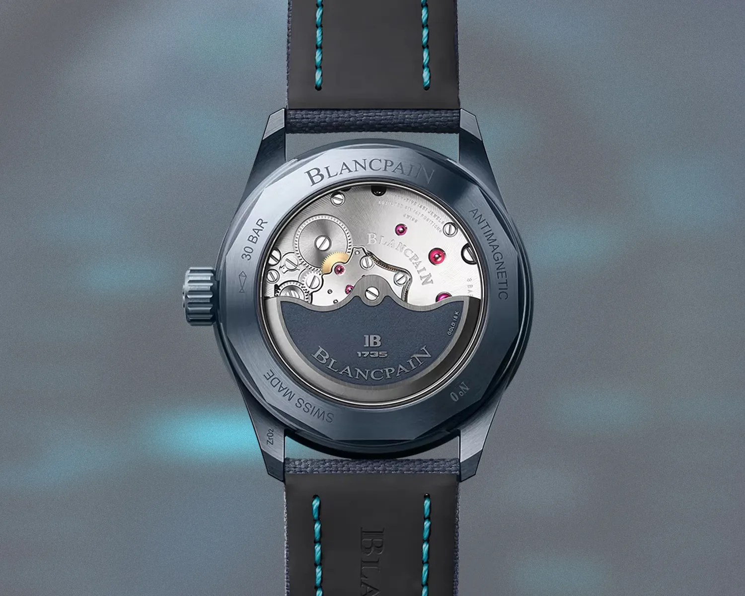 Back of a Blancpain watch showing mechanical movement with blue case and black strap with blue stitching.