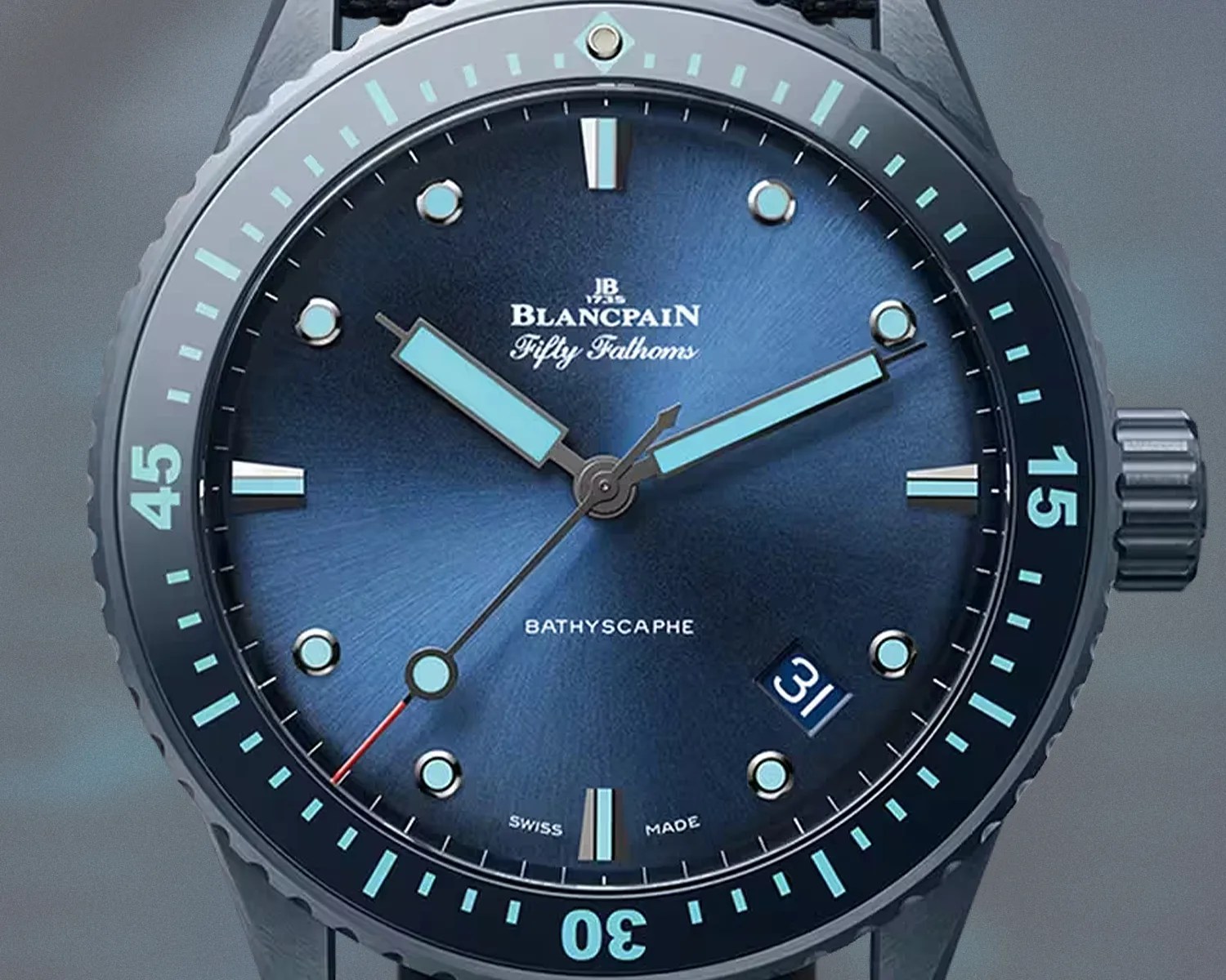 Close-up of a Blancpain Fifty Fathoms Bathyscaphe watch with a blue dial, light blue markers, and a date window at 4:30.