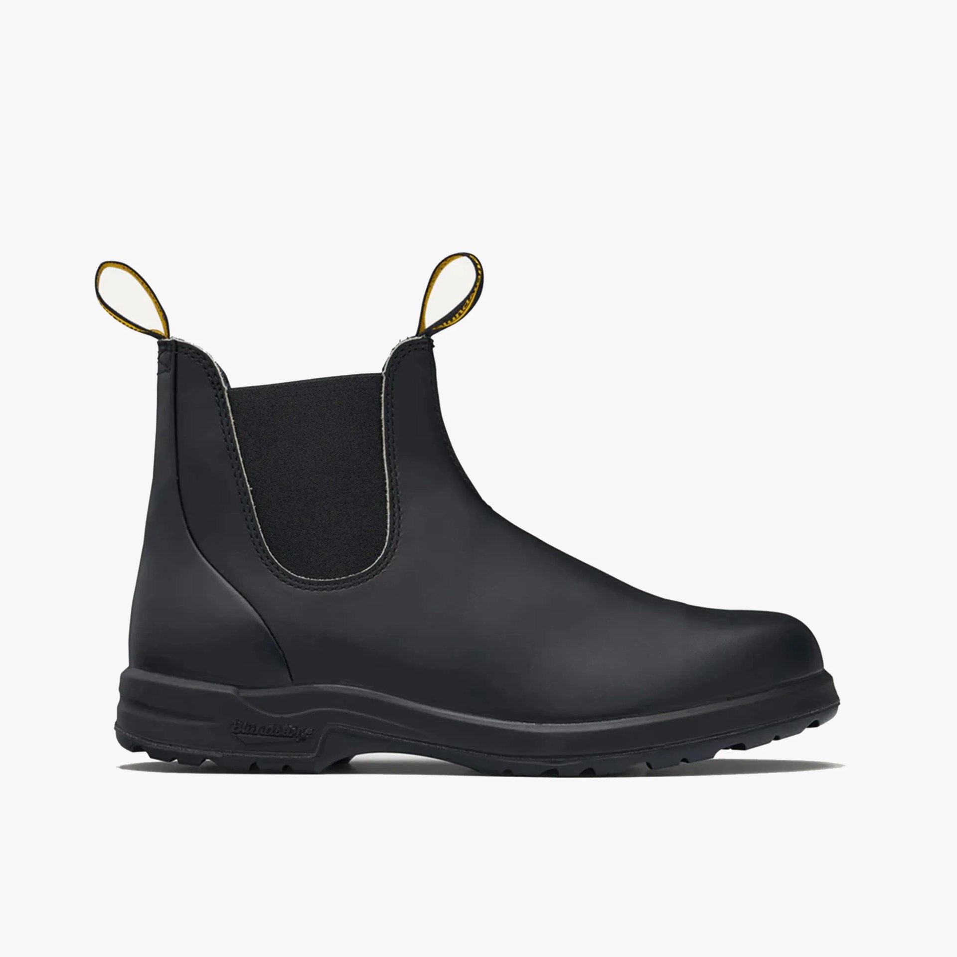 Matte black leather Chelsea boot with elastic side panels and yellow pull tabs.