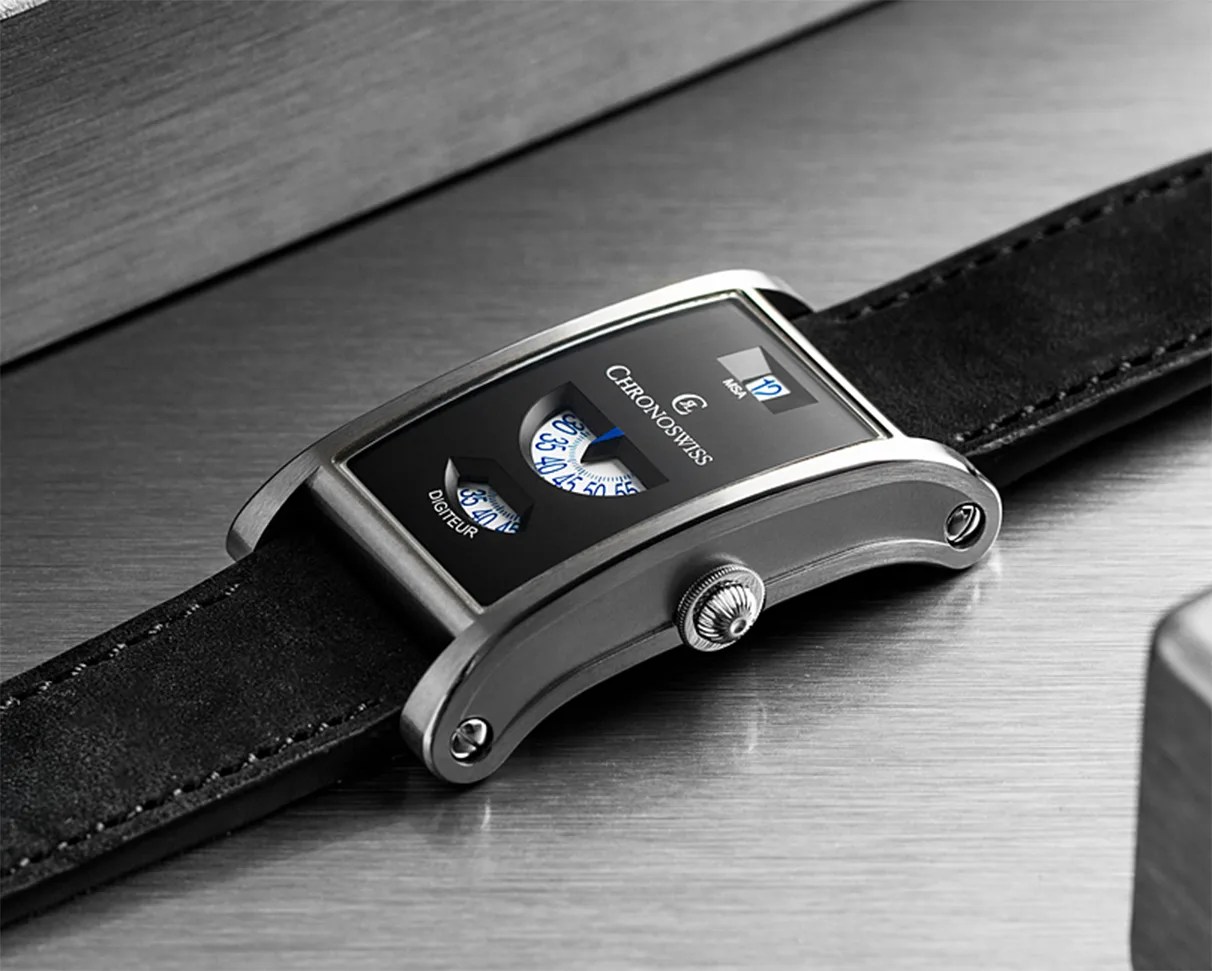 Rectangular Chronoswiss wristwatch with black dial, digital display windows, brushed metal case, and black suede strap.