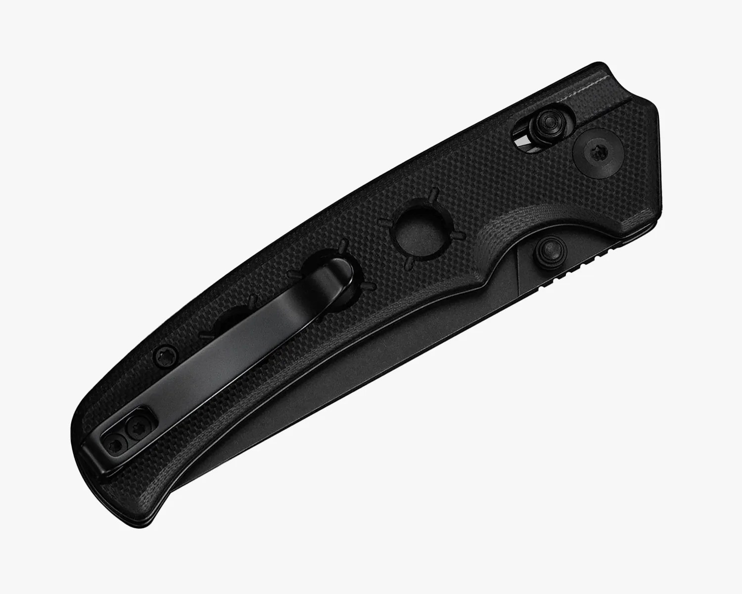 Black folding pocket knife with textured handle and metal clip on a white background.