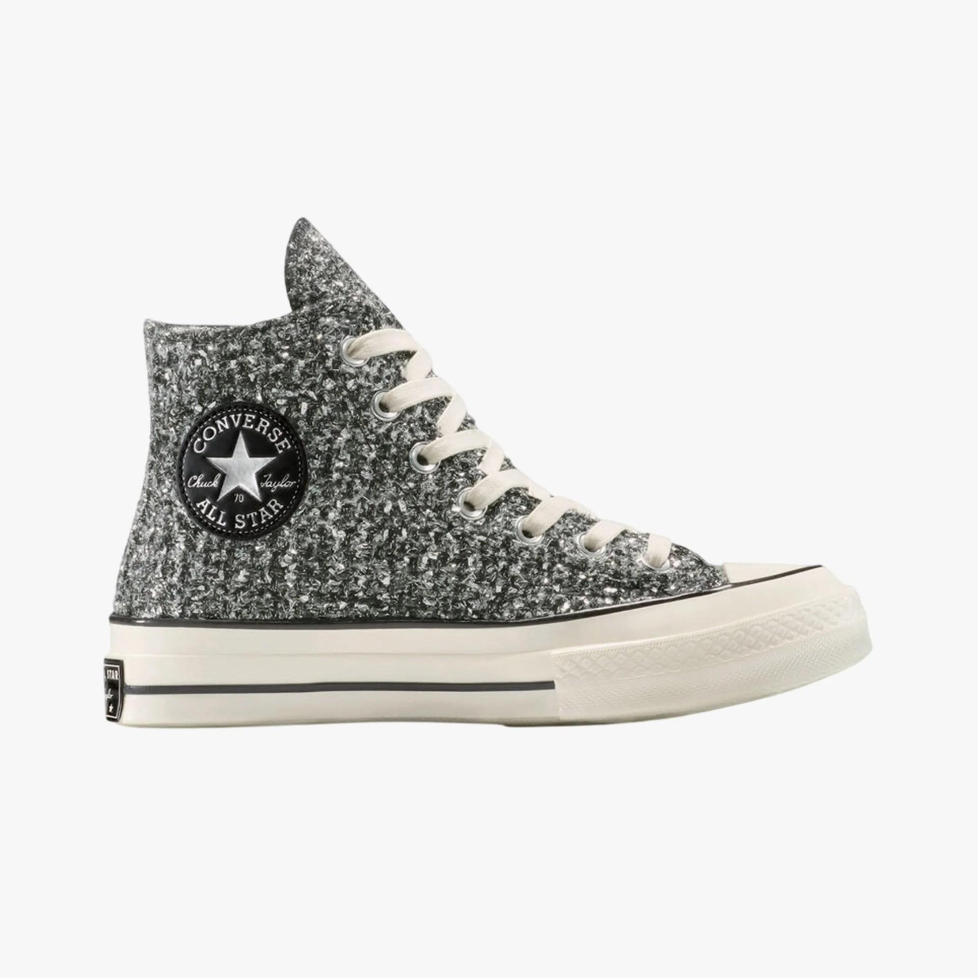 High-top Converse All Star sneaker with a textured black and white knit upper and white rubber sole.
