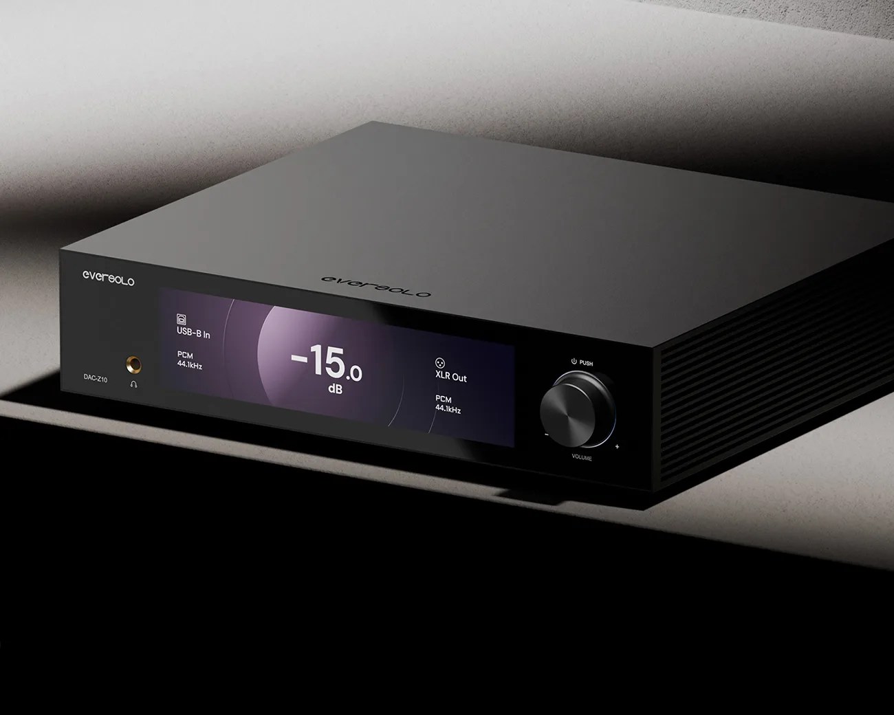 Black EverSolo DAC-Z10 digital-to-analog converter with a digital display showing -15 dB volume and a volume knob.