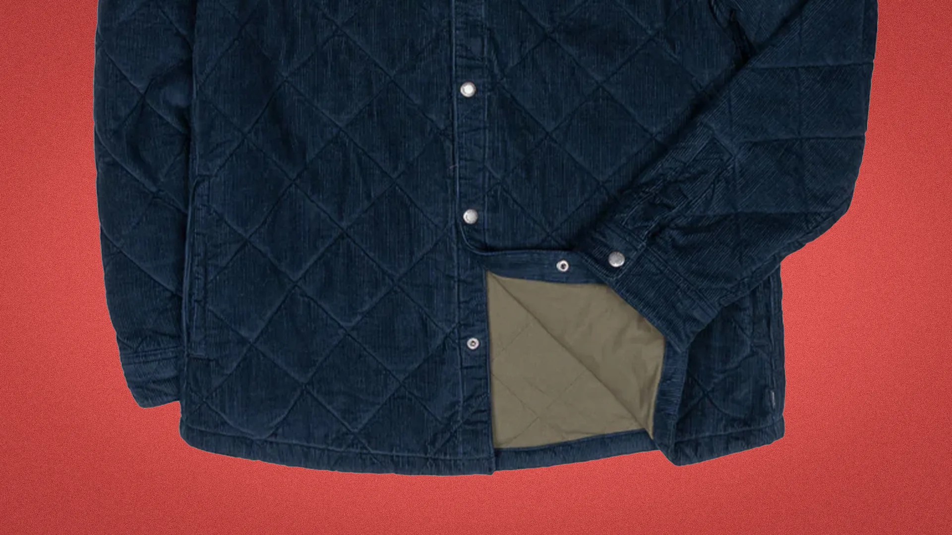 Quilted navy blue jacket with snap buttons and olive green lining visible at the hem.